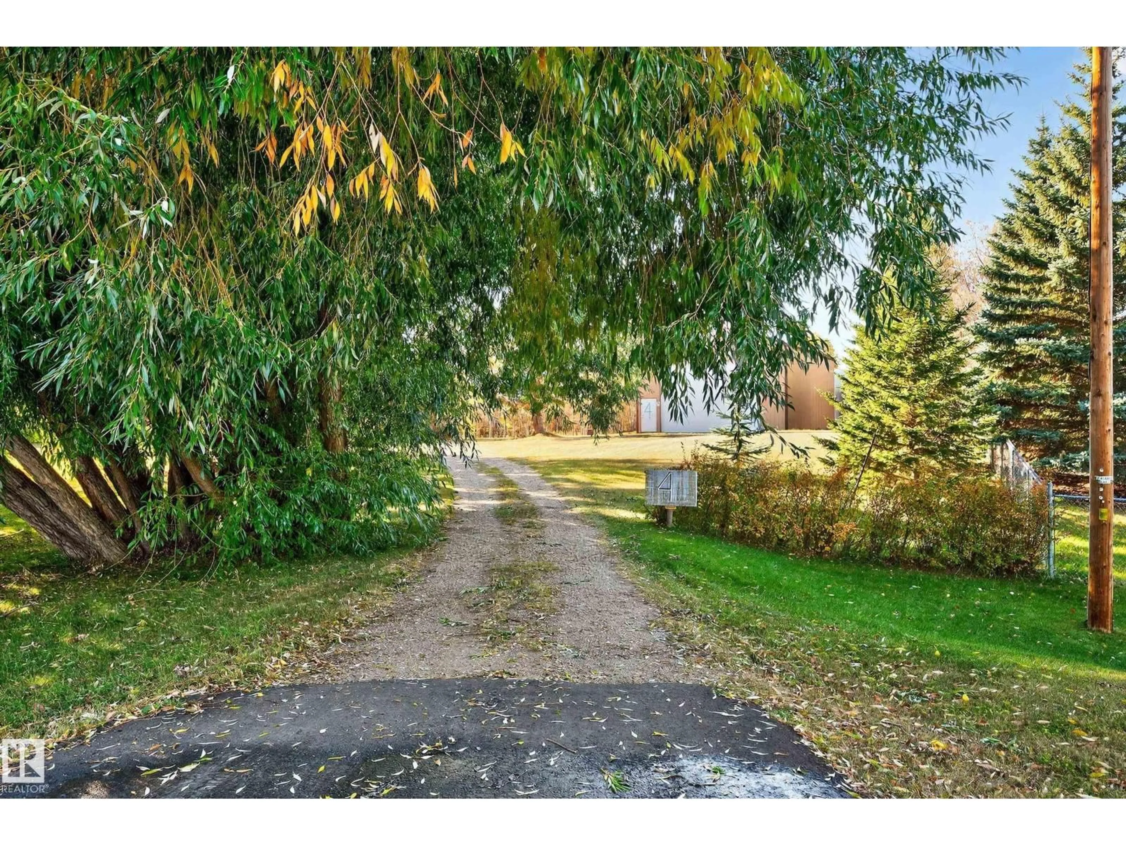 A pic from outside/outdoor area/front of a property/back of a property/a pic from drone, street for 51317 - 4 HGHWAY 60, Rural Parkland County Alberta T7Y1C4