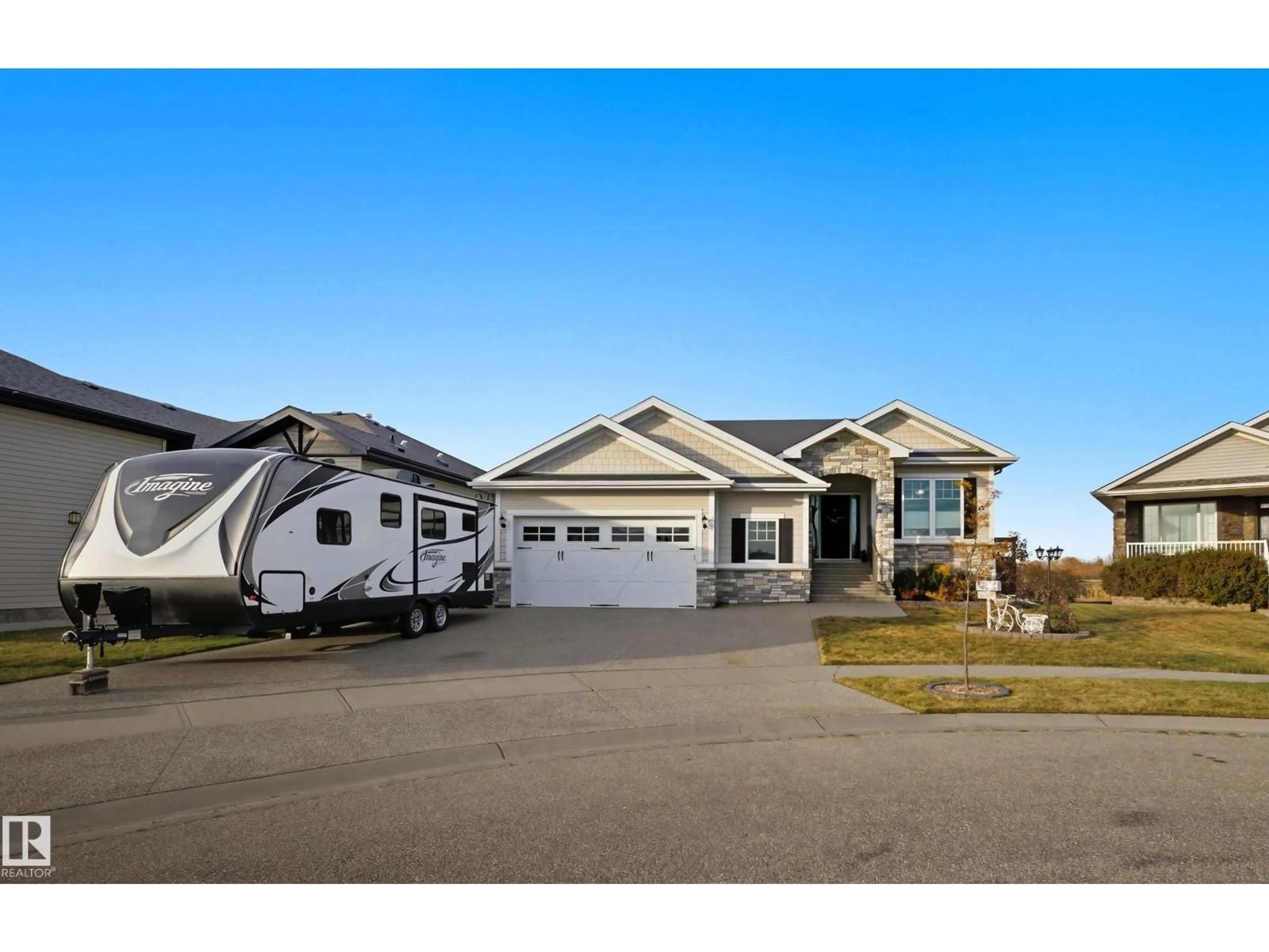 Home with vinyl exterior material, street for 10504 103 AV, Morinville Alberta T8R0E7