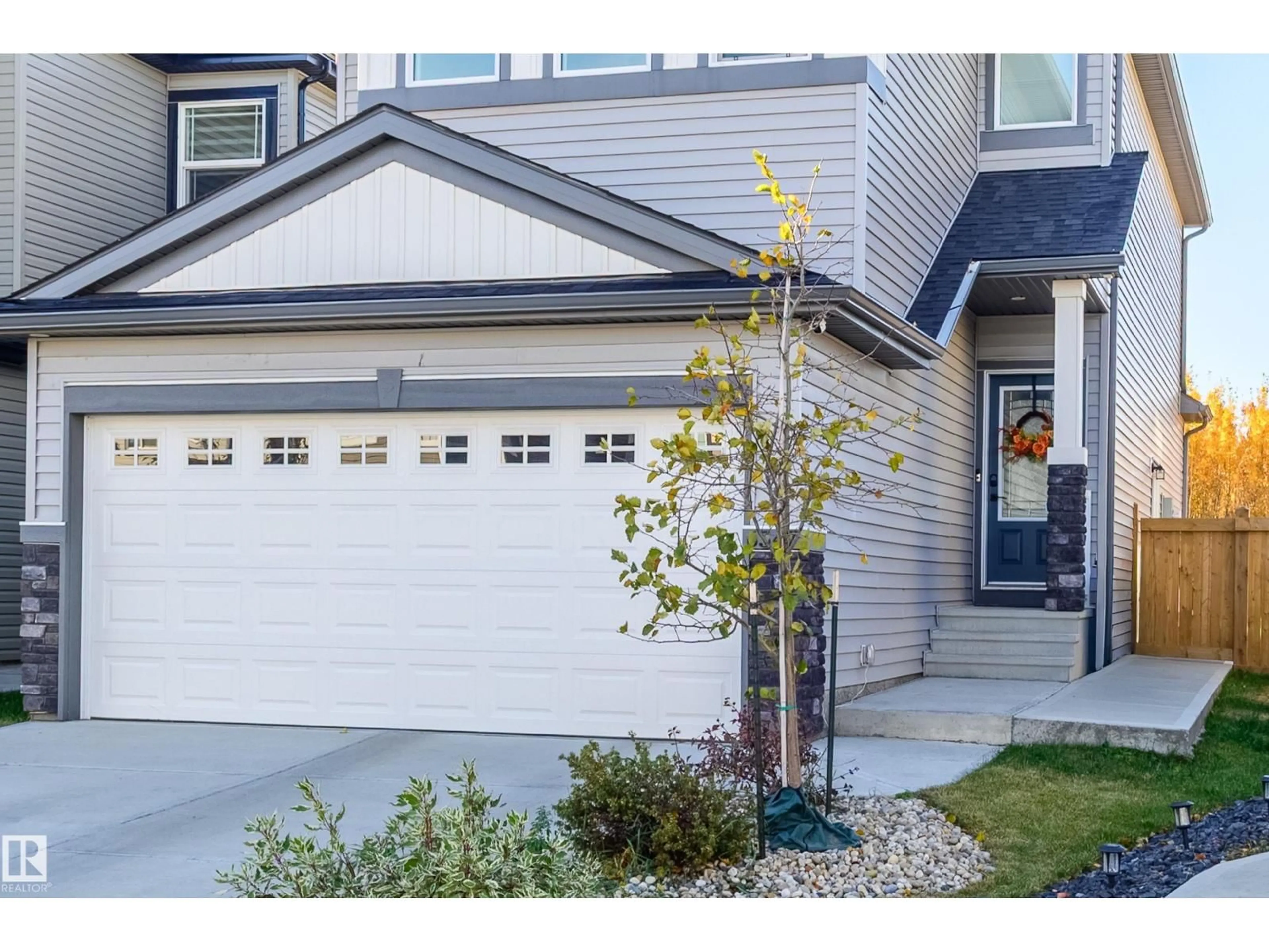 Home with vinyl exterior material, street for NW - 6547 175 AV, Edmonton Alberta T5Y4B3