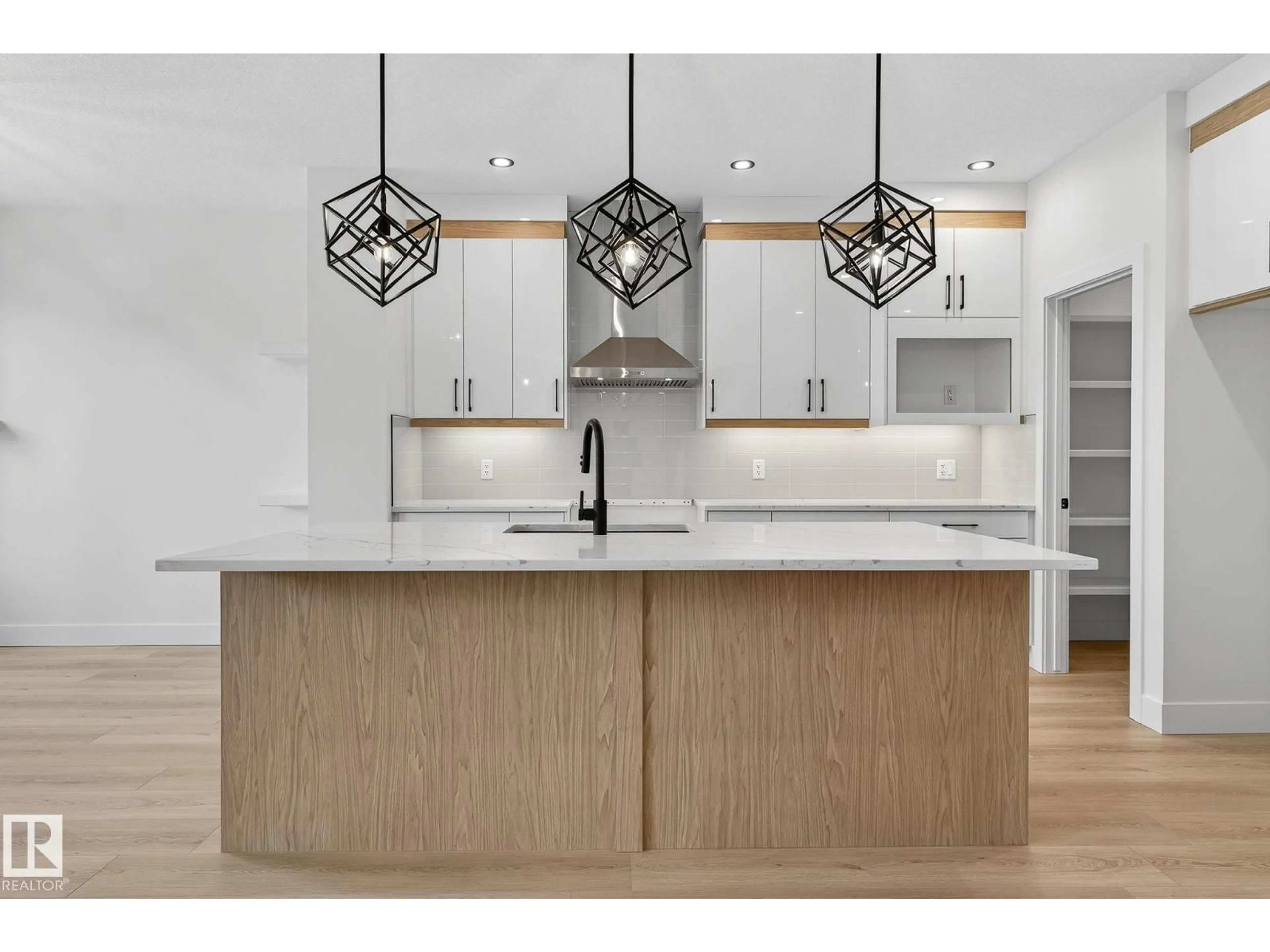 Open concept kitchen, wood/laminate floor for 136 WYATT RG, Fort Saskatchewan Alberta T8L3L7