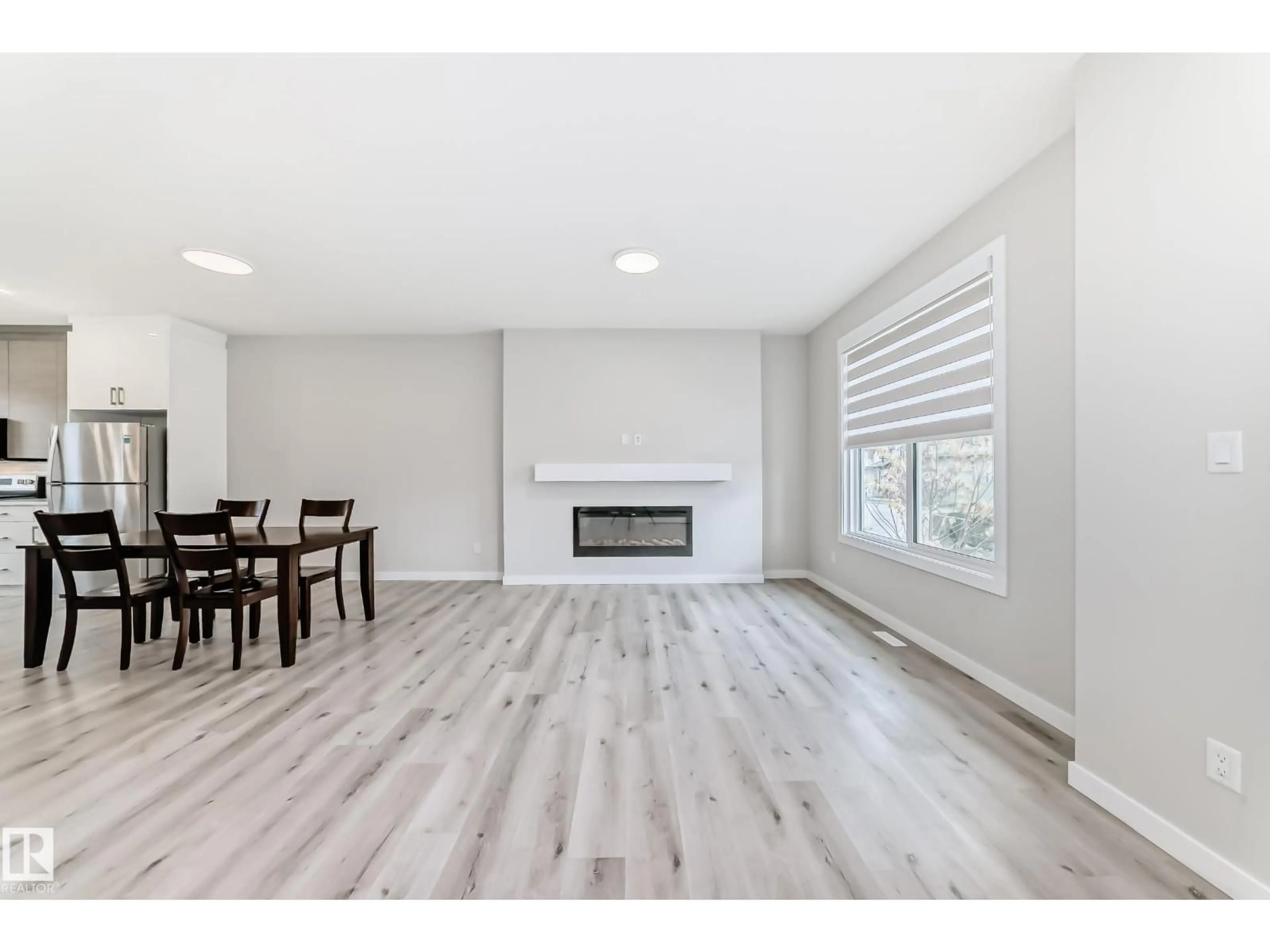 Living room with furniture, wood/laminate floor for VS - 6536 CHAPPELLE VISTA SW, Edmonton Alberta A6W4A3