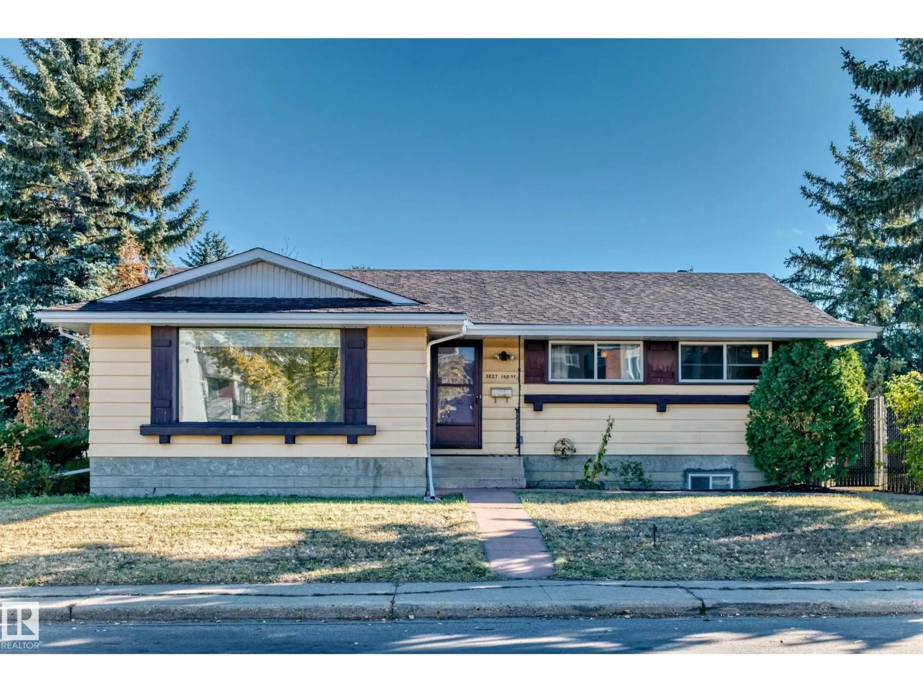 Home with vinyl exterior material, street for NW - 3827 105 ST, Edmonton Alberta T5K0Z5