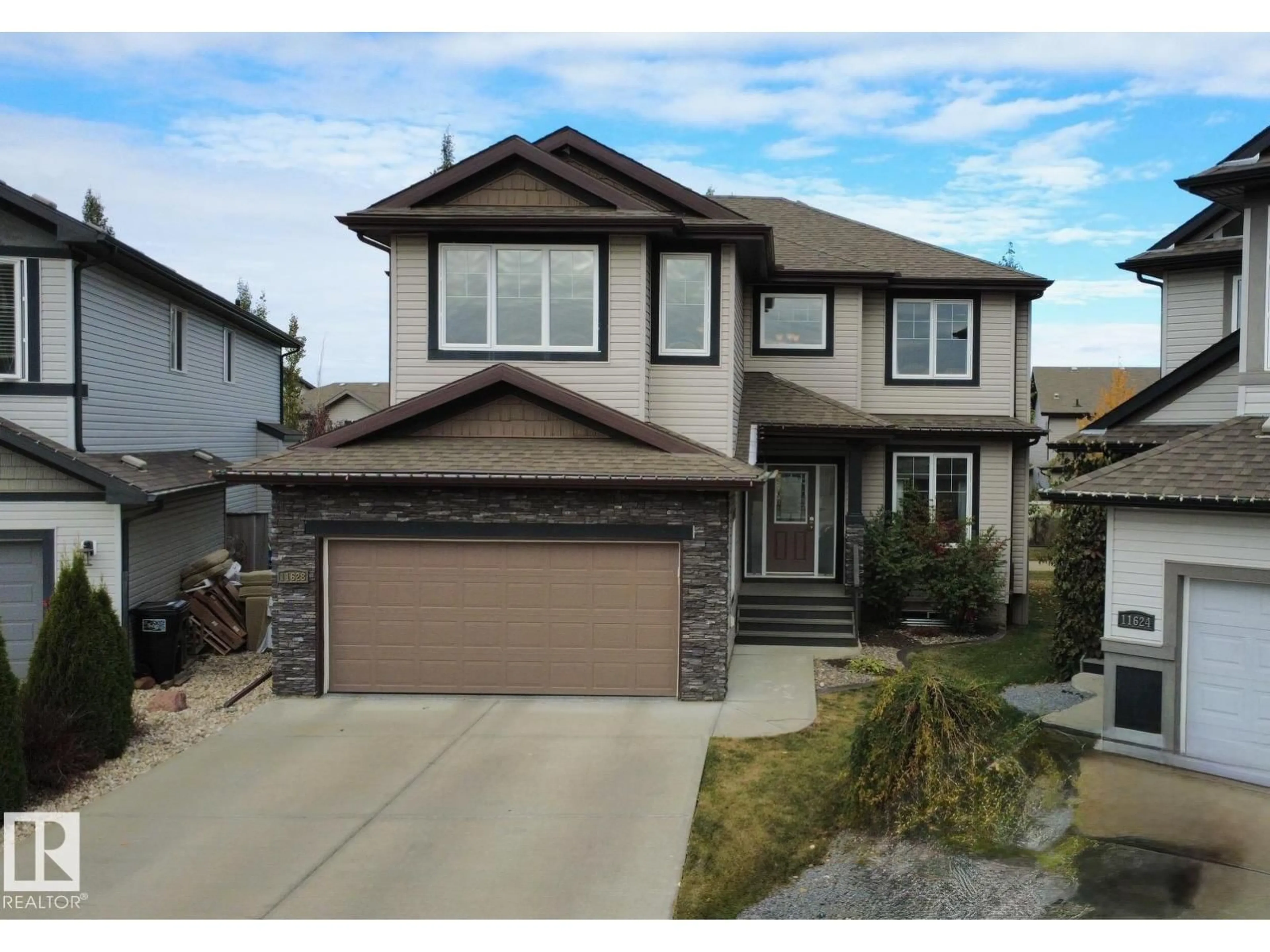 Home with vinyl exterior material, street for SW - 11628 16 AV, Edmonton Alberta T6W1M9