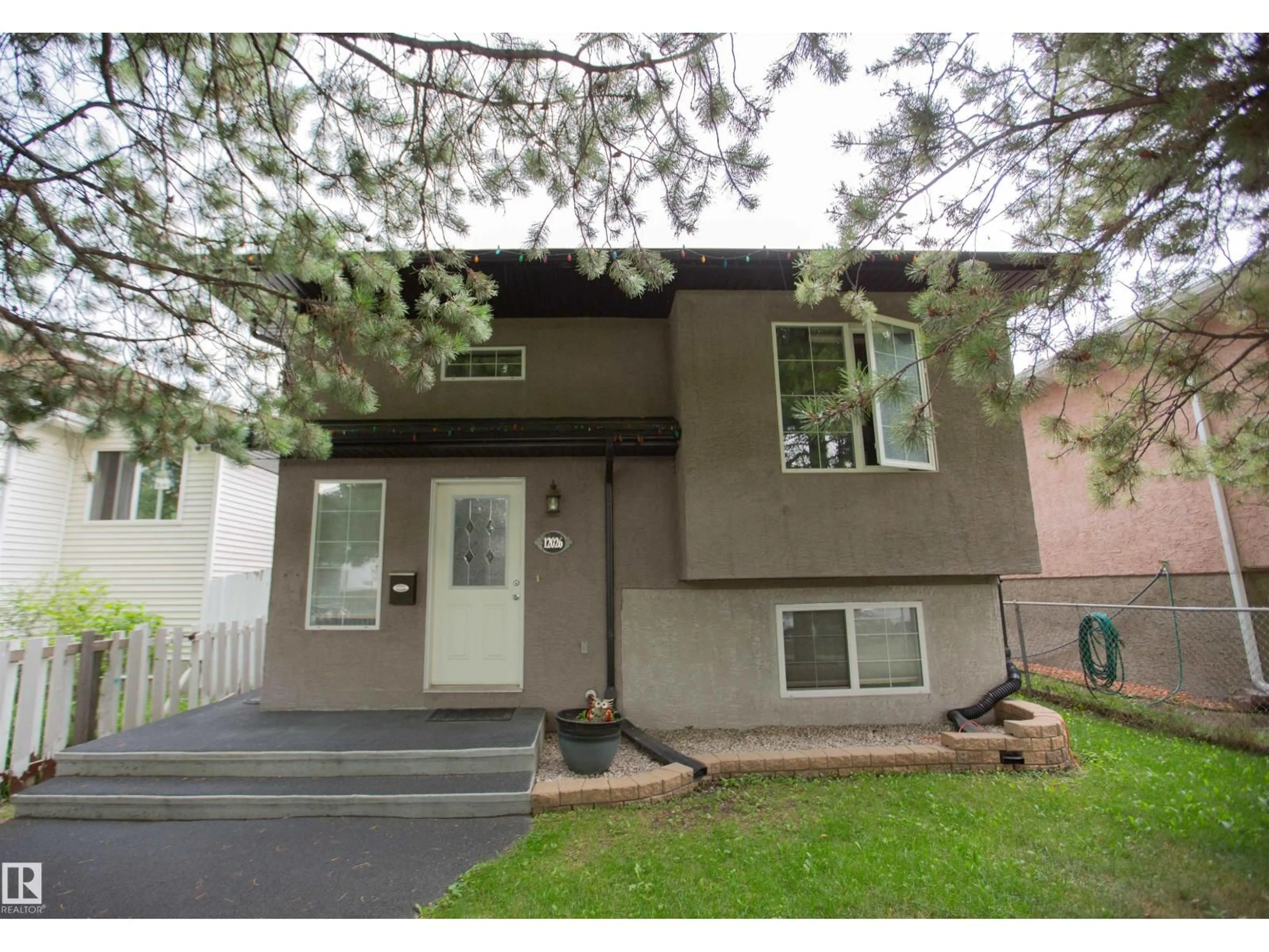 Home with vinyl exterior material, street for NW - 12026 91 ST, Edmonton Alberta T5B4B8