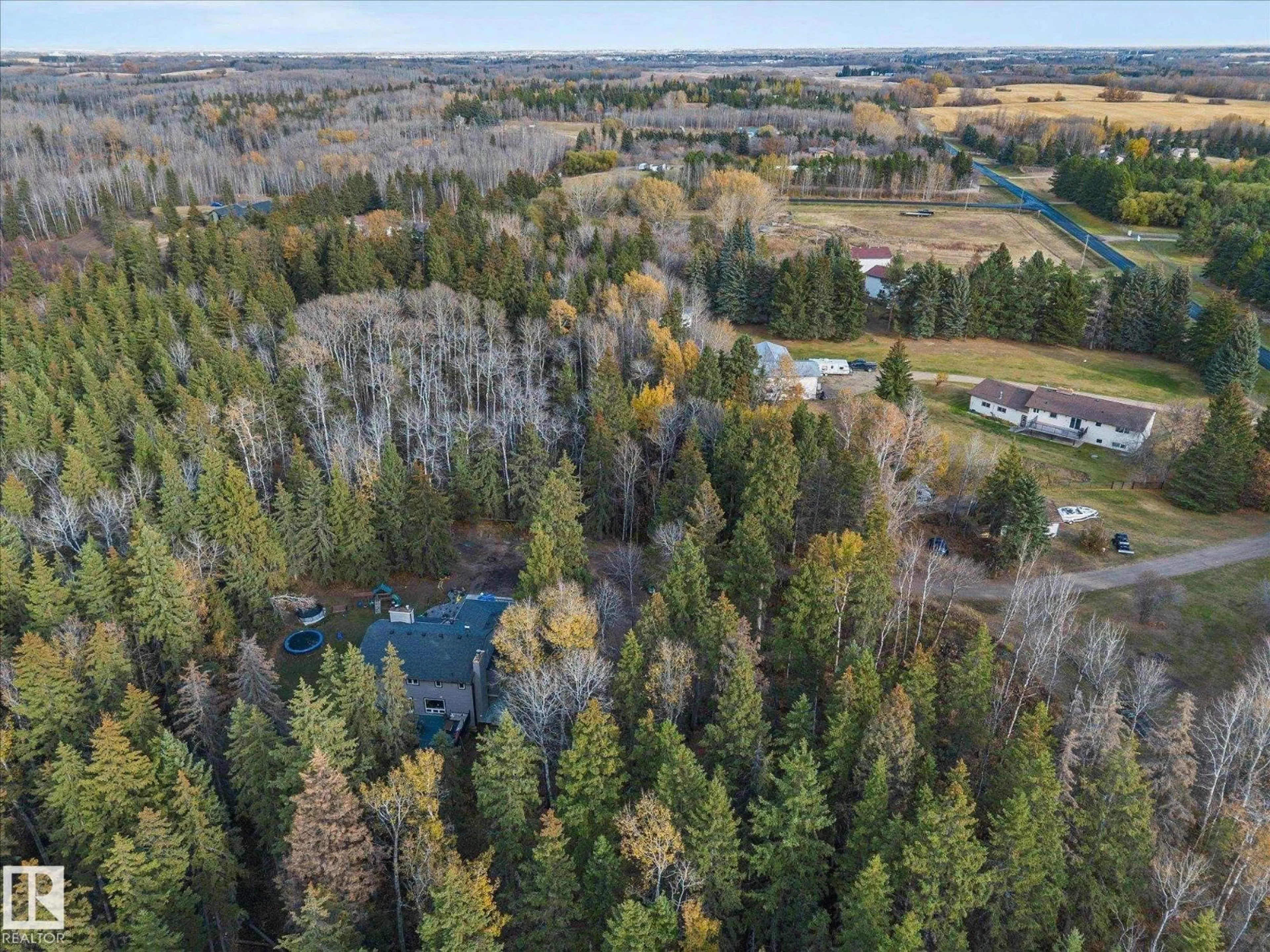 A pic from outside/outdoor area/front of a property/back of a property/a pic from drone, forest/trees view for 22 52420 RGE ROAD 13, Rural Parkland County Alberta T7Y2C1