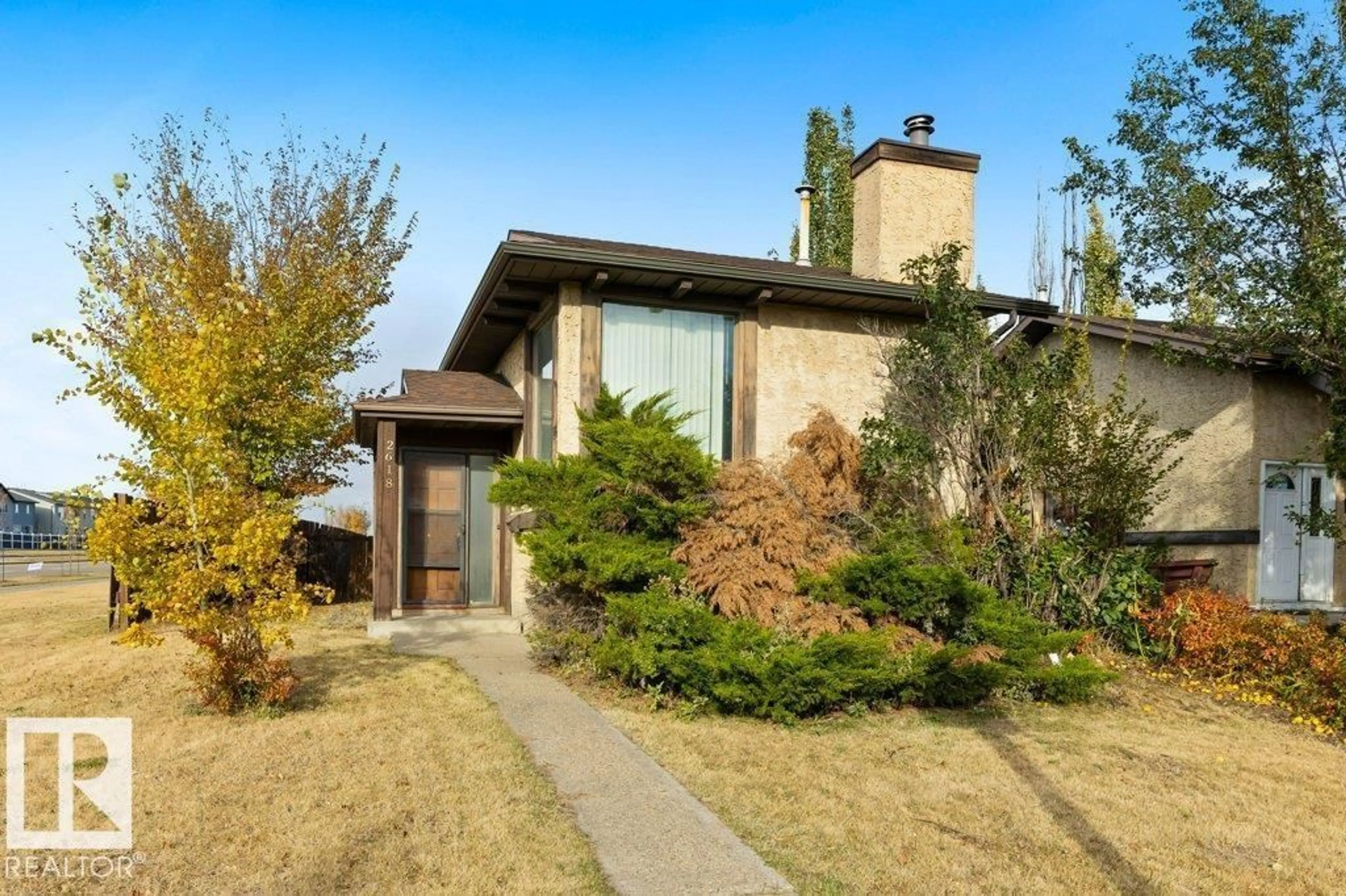 Home with brick exterior material, street for NW - 2618 151 AV, Edmonton Alberta T5Y1Z3