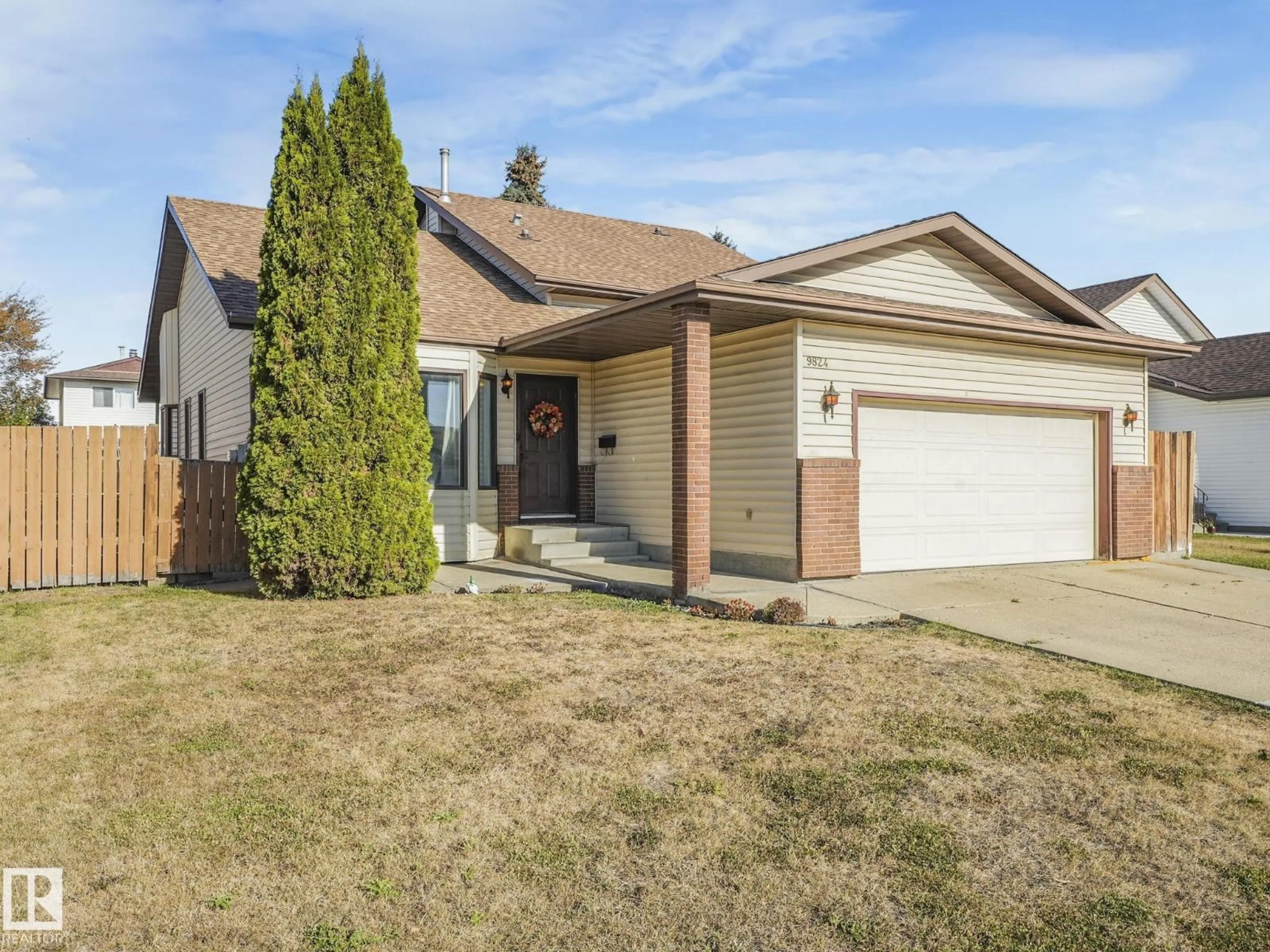 Home with vinyl exterior material, street for 9824 164 AV, Edmonton Alberta T5X5H6