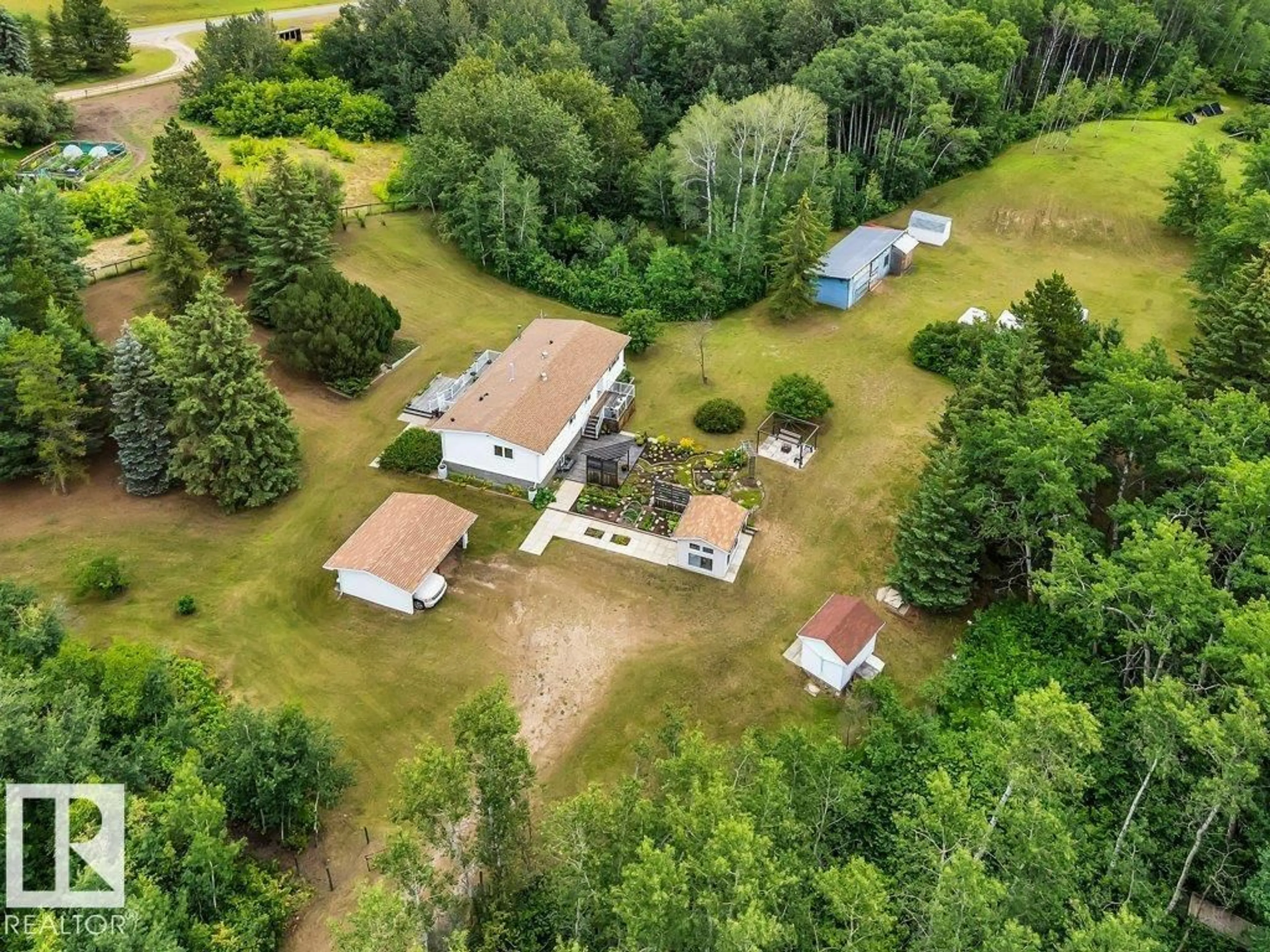 A pic from outside/outdoor area/front of a property/back of a property/a pic from drone, unknown for 24 - 51213 RGE RD 261, Rural Parkland County Alberta T7Y1B1