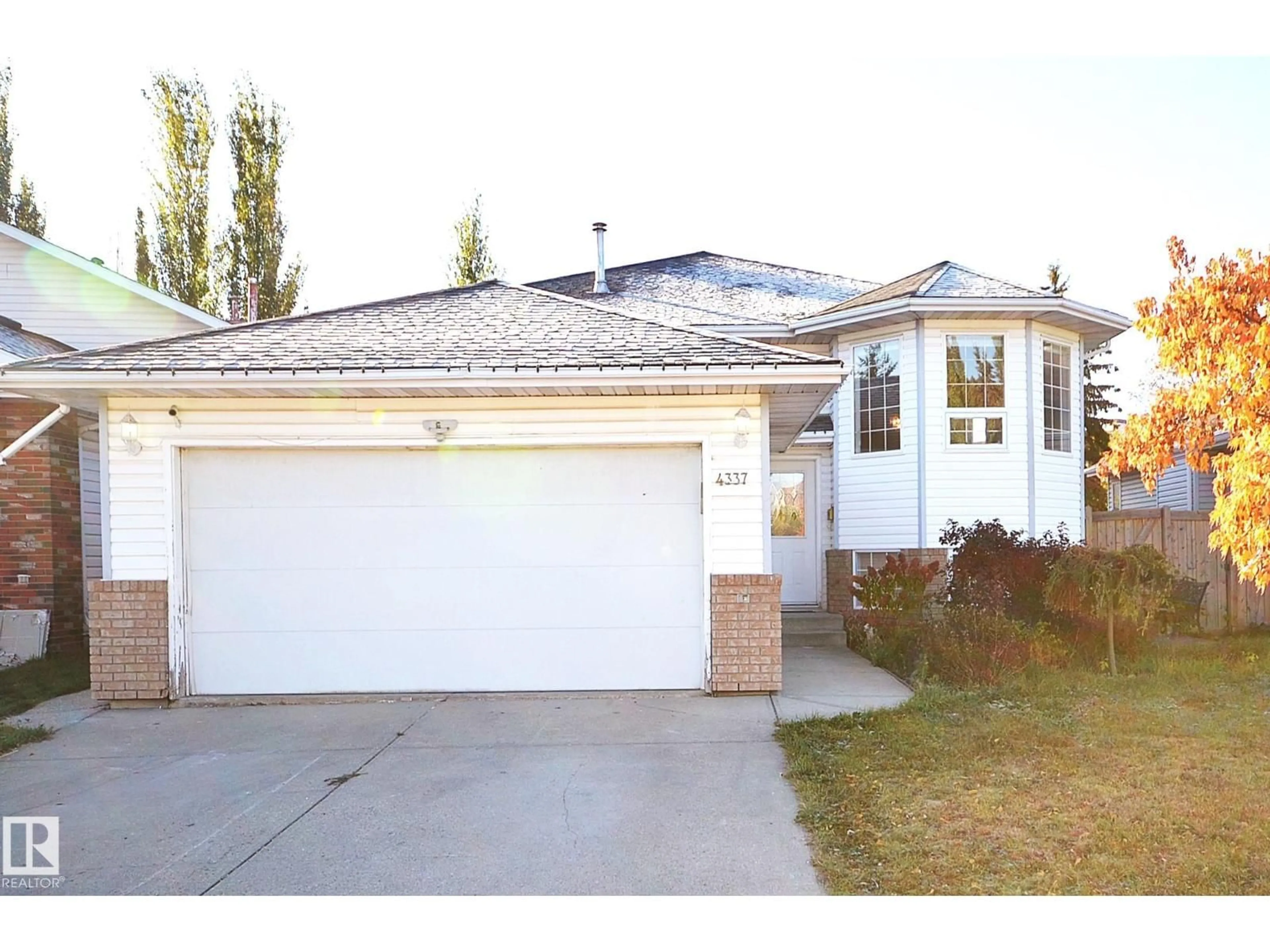 Home with vinyl exterior material, street for 4337 21 AV, Edmonton Alberta T6L6L8