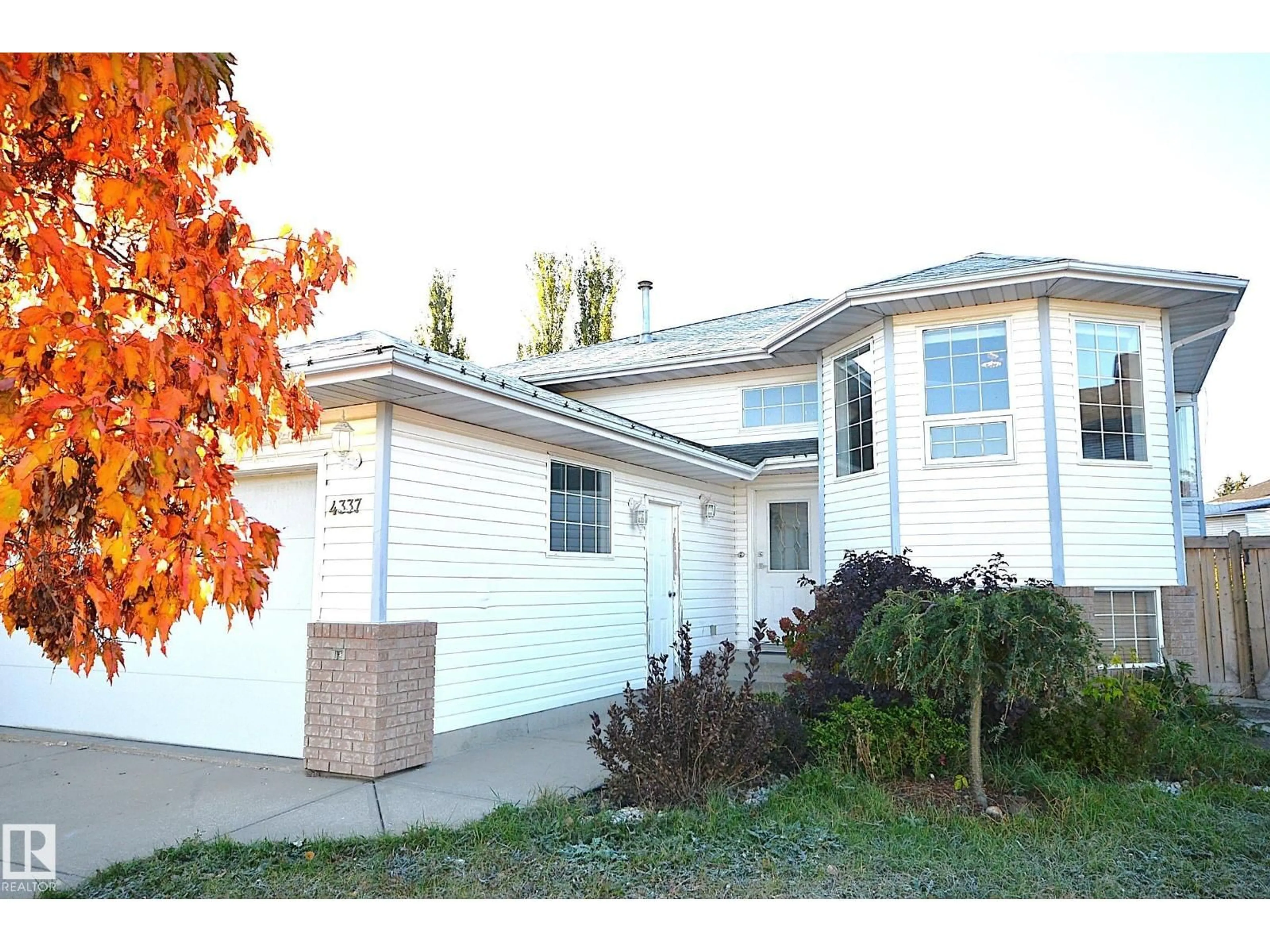 Home with vinyl exterior material, street for 4337 21 AV, Edmonton Alberta T6L6L8