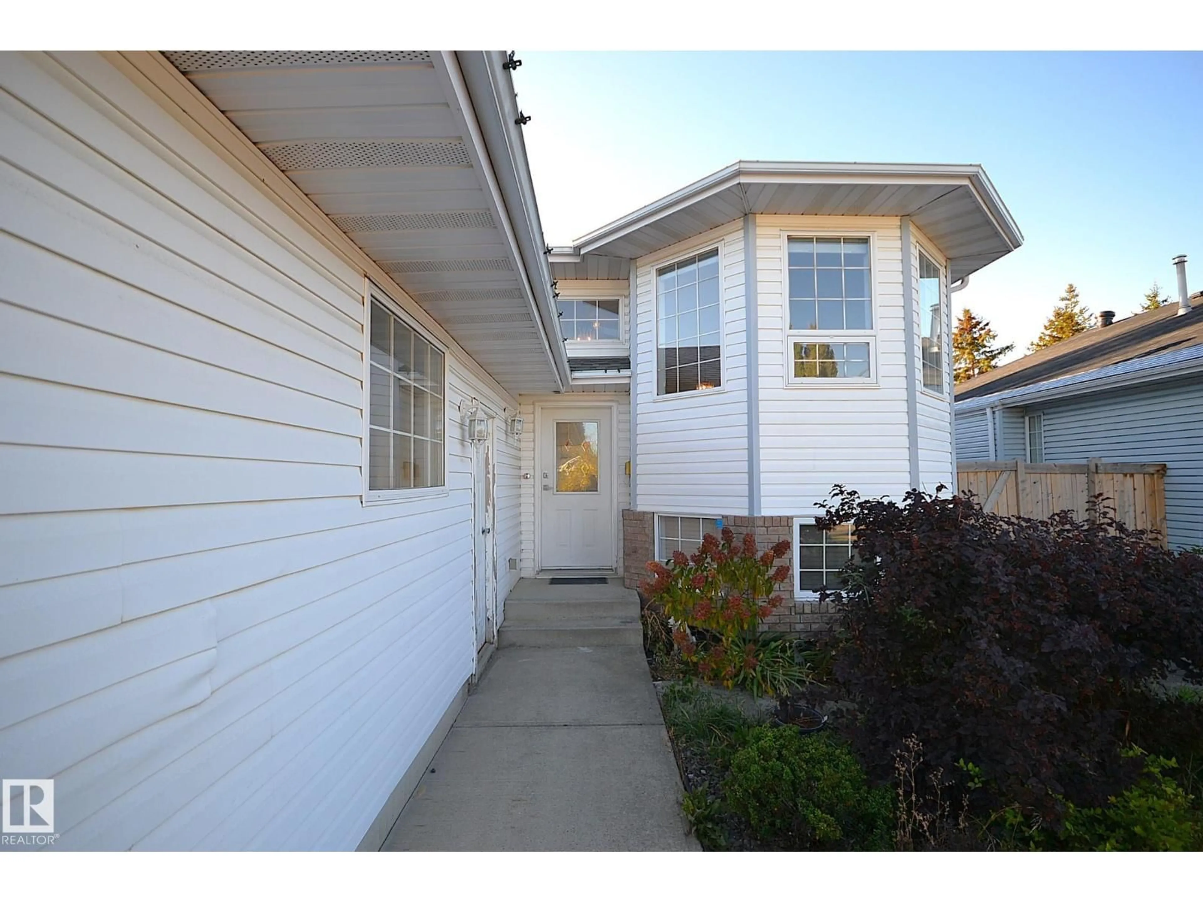 Home with vinyl exterior material, street for 4337 21 AV, Edmonton Alberta T6L6L8