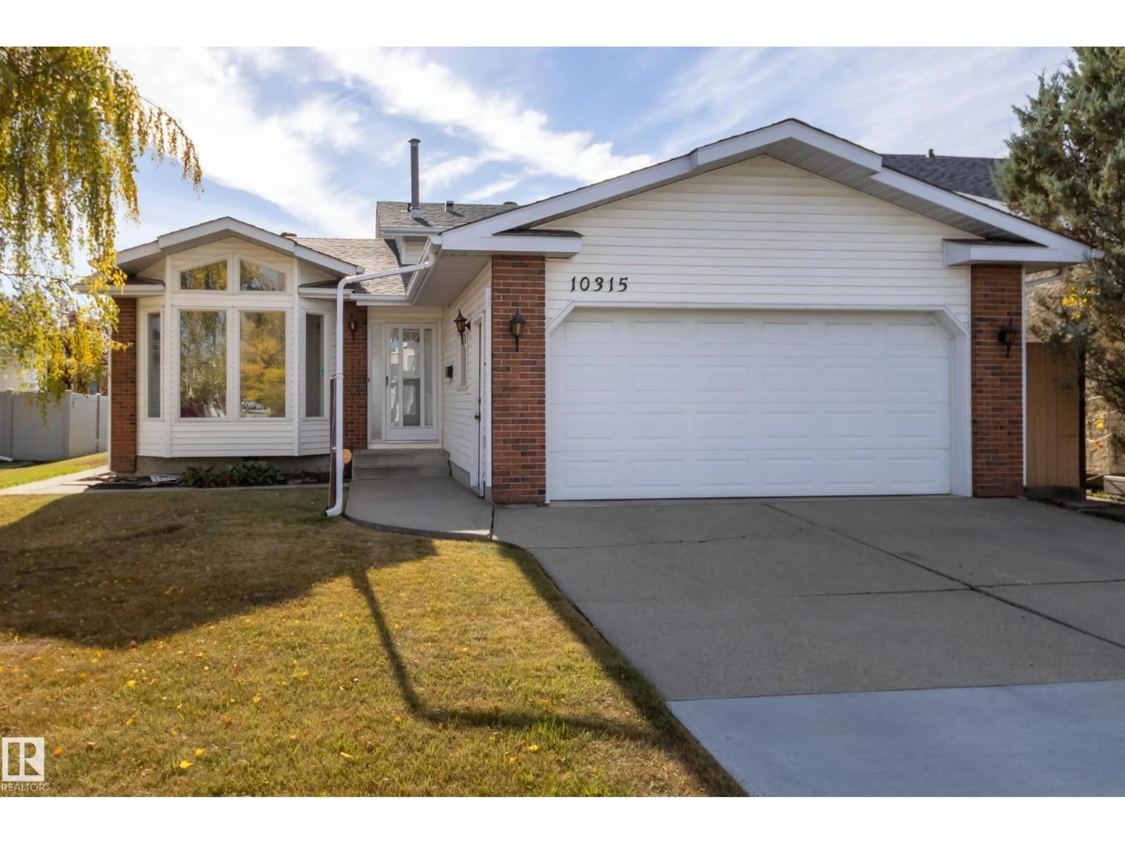 Home with vinyl exterior material, street for 10315 154 AV, Edmonton Alberta T5X5R1