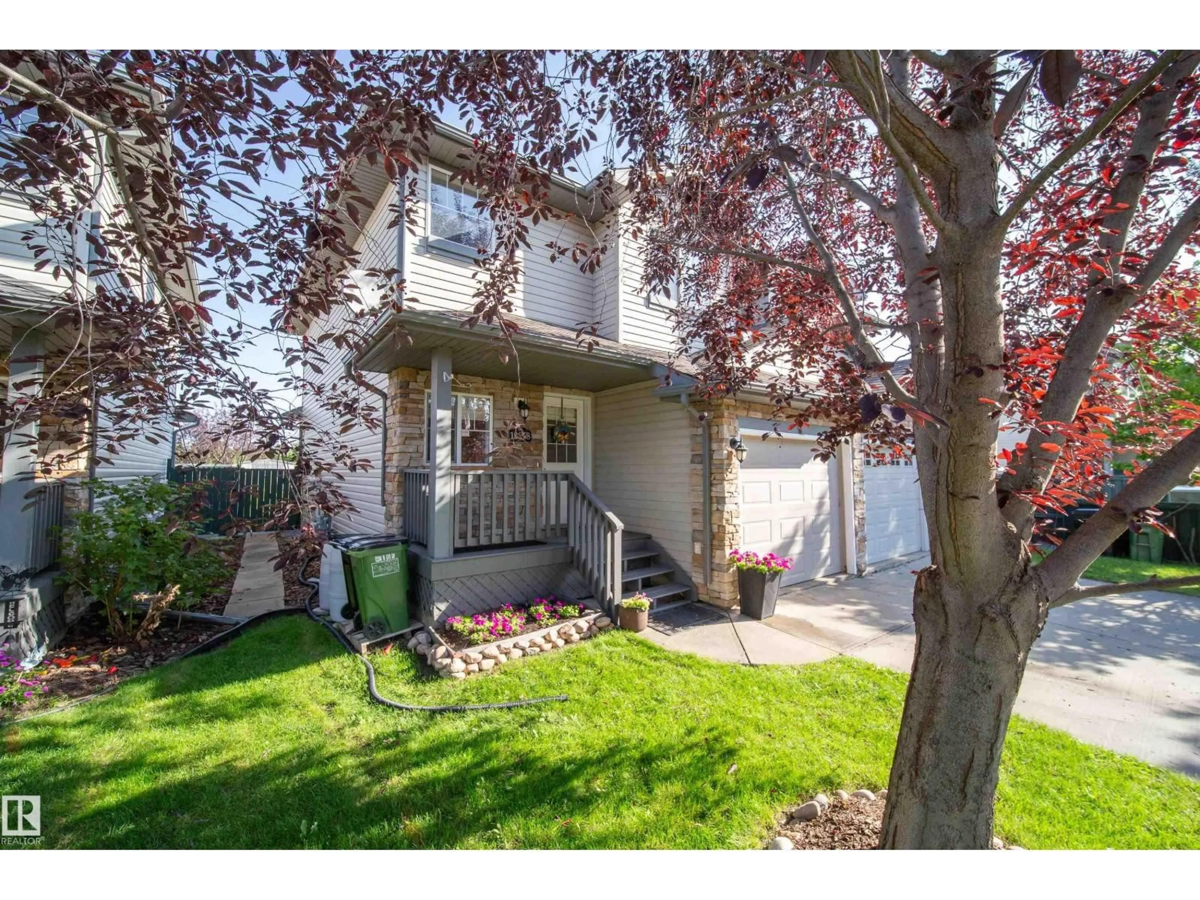 Home with vinyl exterior material, street for 12208 16 AV, Edmonton Alberta T6W1L8