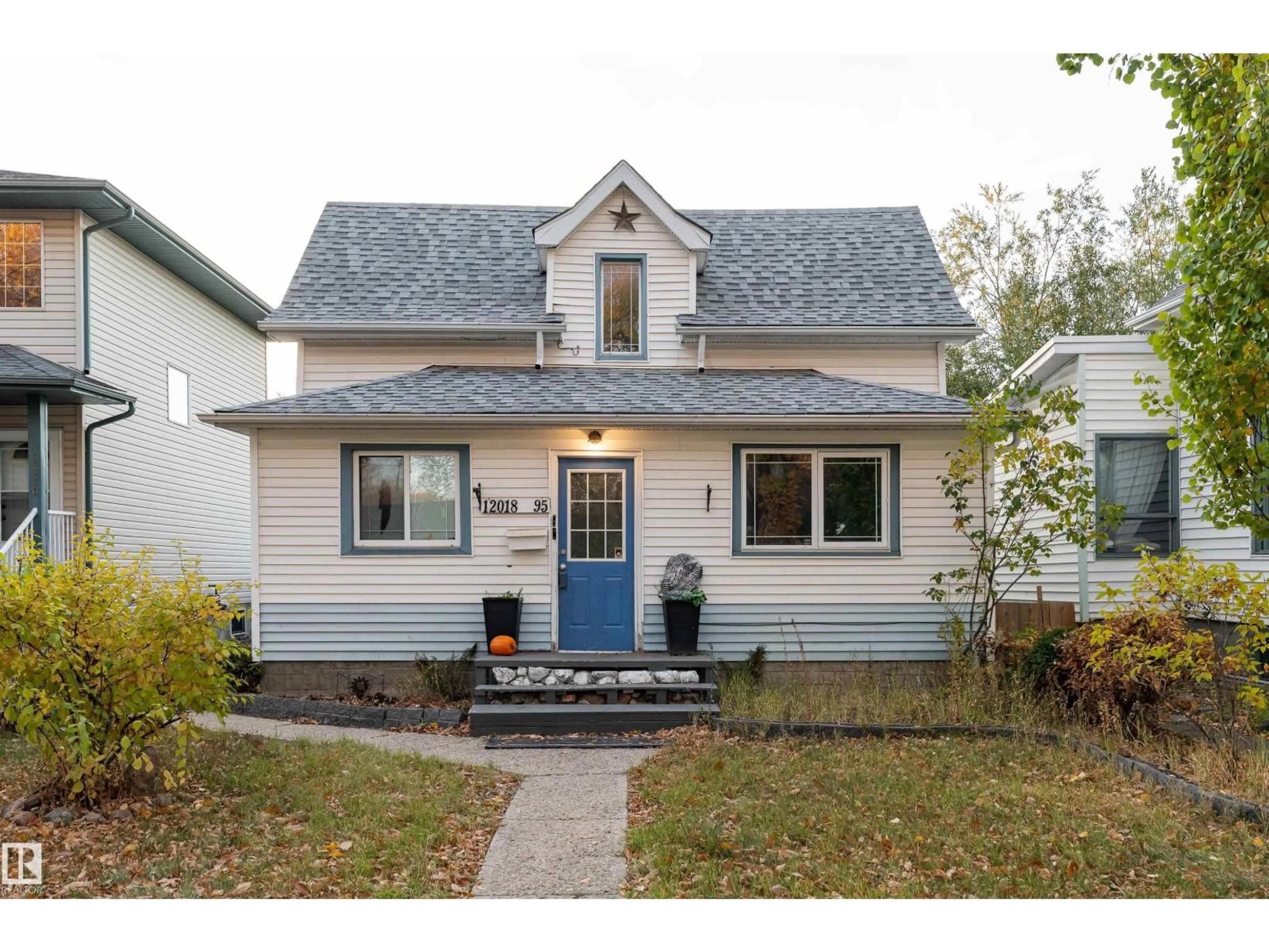 Home with vinyl exterior material, street for NW - 12018 95 ST, Edmonton Alberta T5G1M7