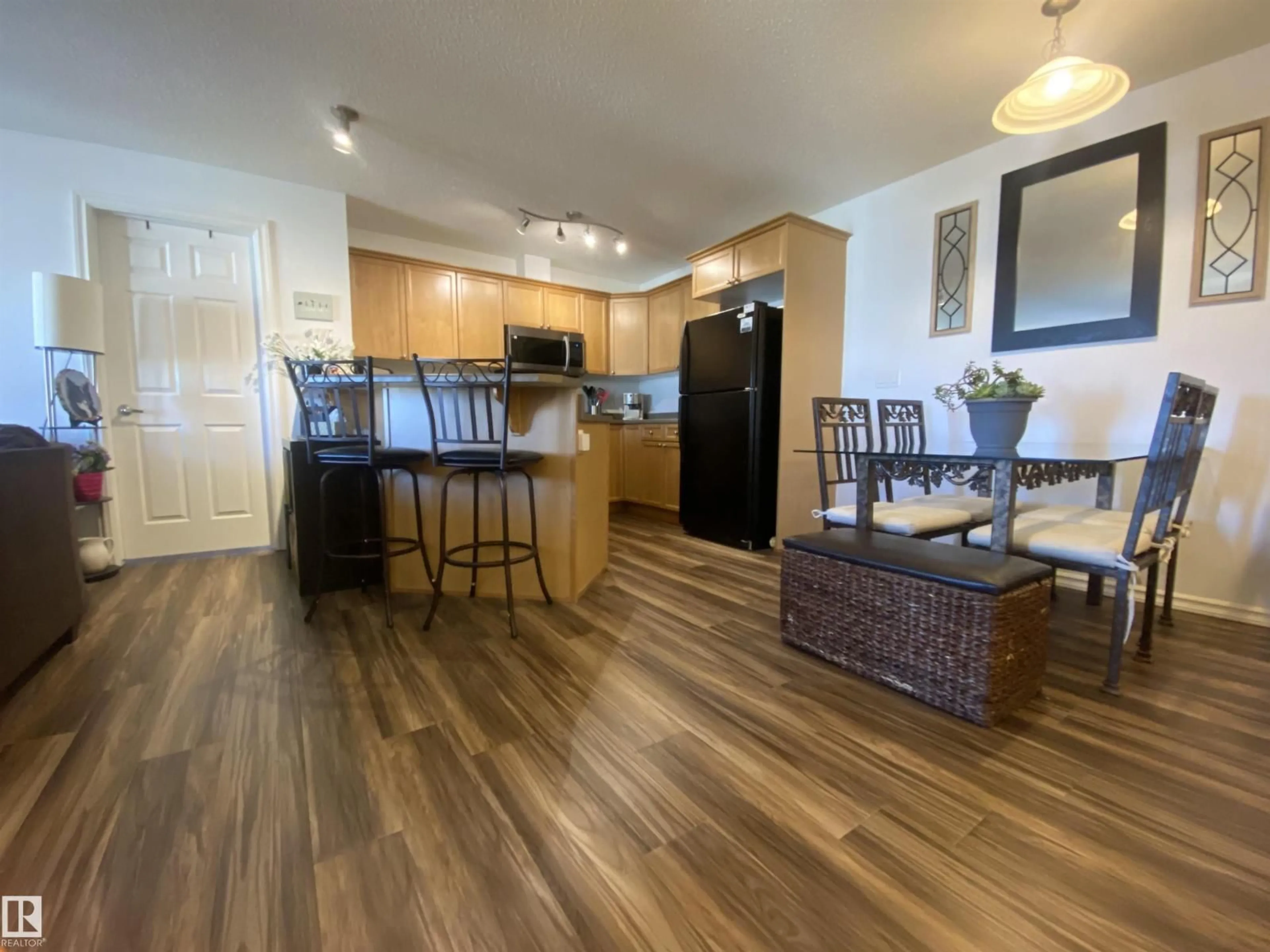 Open concept kitchen, wood/laminate floor for 403 - 4403 23 ST, Edmonton Alberta T6T0E4
