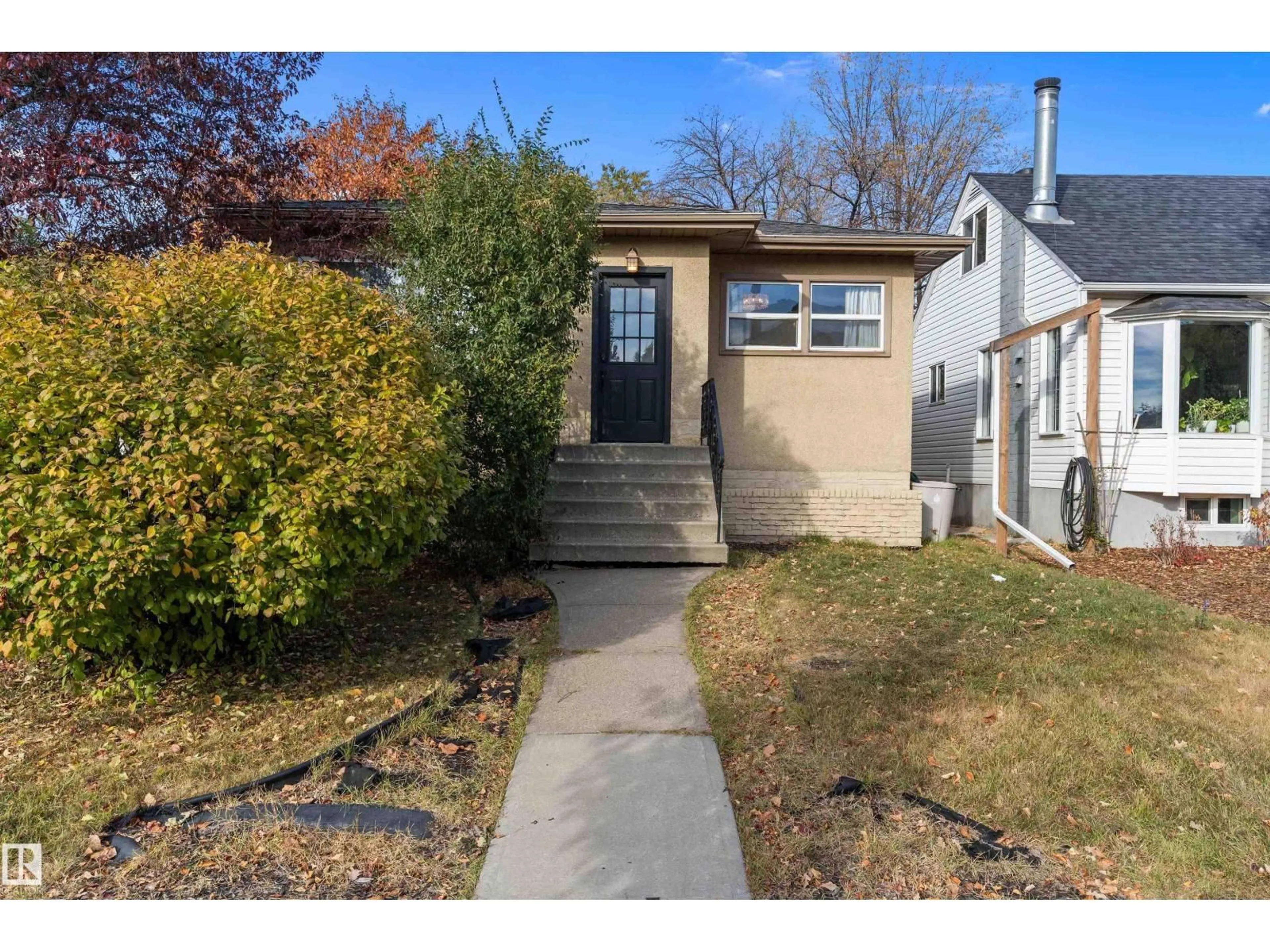 Home with vinyl exterior material, street for 10632 73 AV, Edmonton Alberta T6E1C4