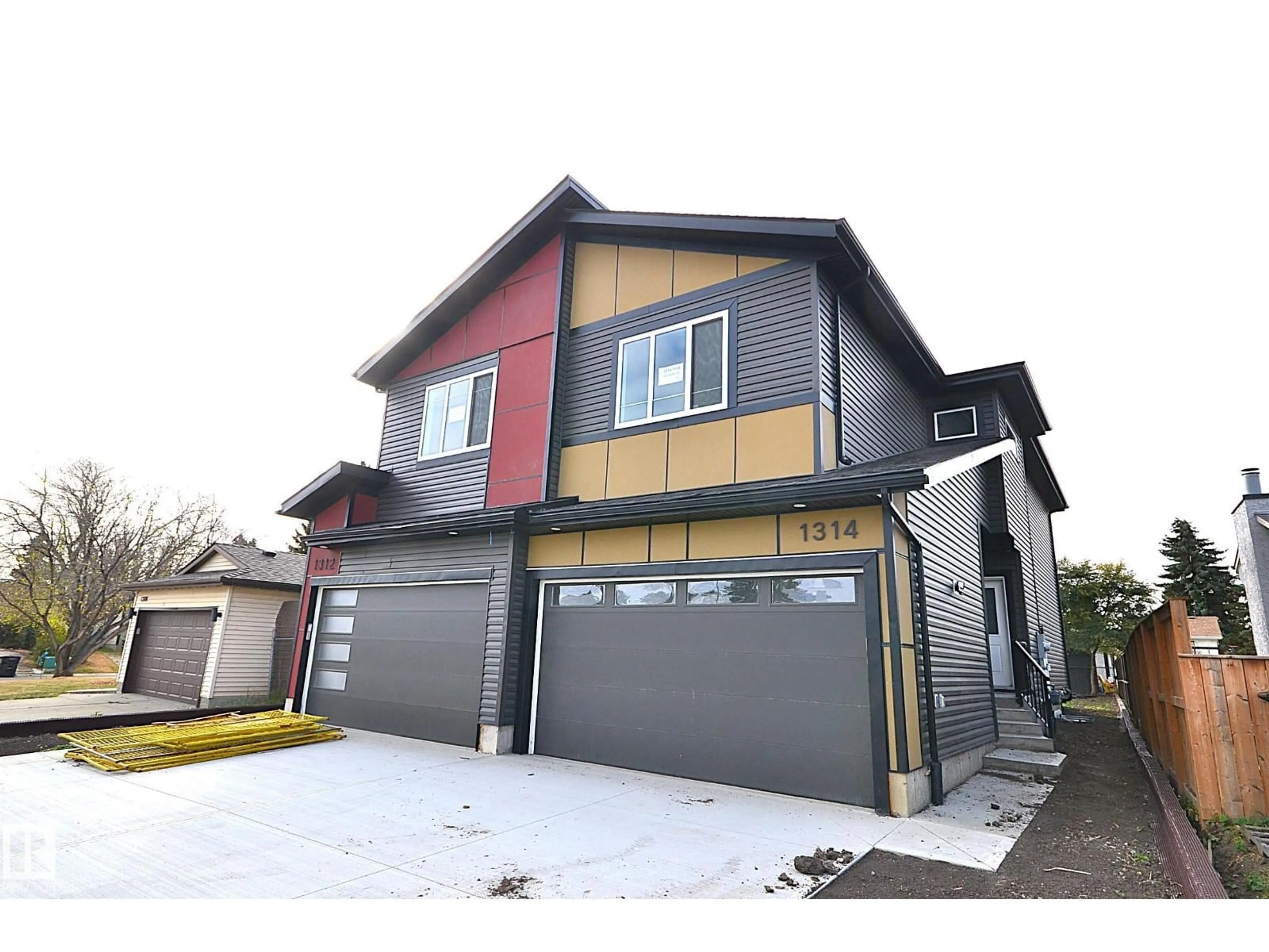 Home with vinyl exterior material, street for NW - 1312 35 ST, Edmonton Alberta T6L3E8