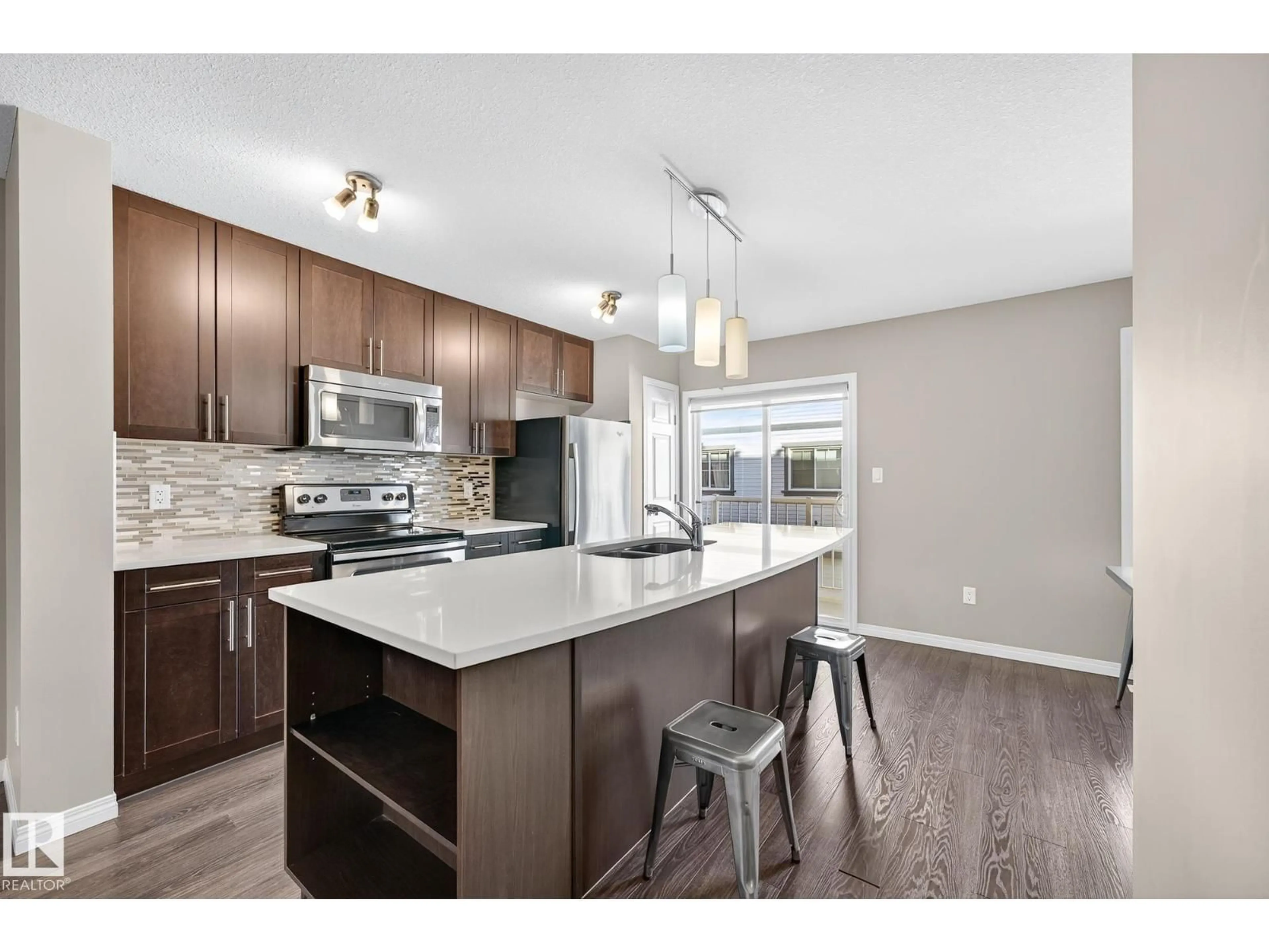Open concept kitchen, wood/laminate floor for #49 - 4850 TERWILLEGAR CM, Edmonton Alberta T6R0T6