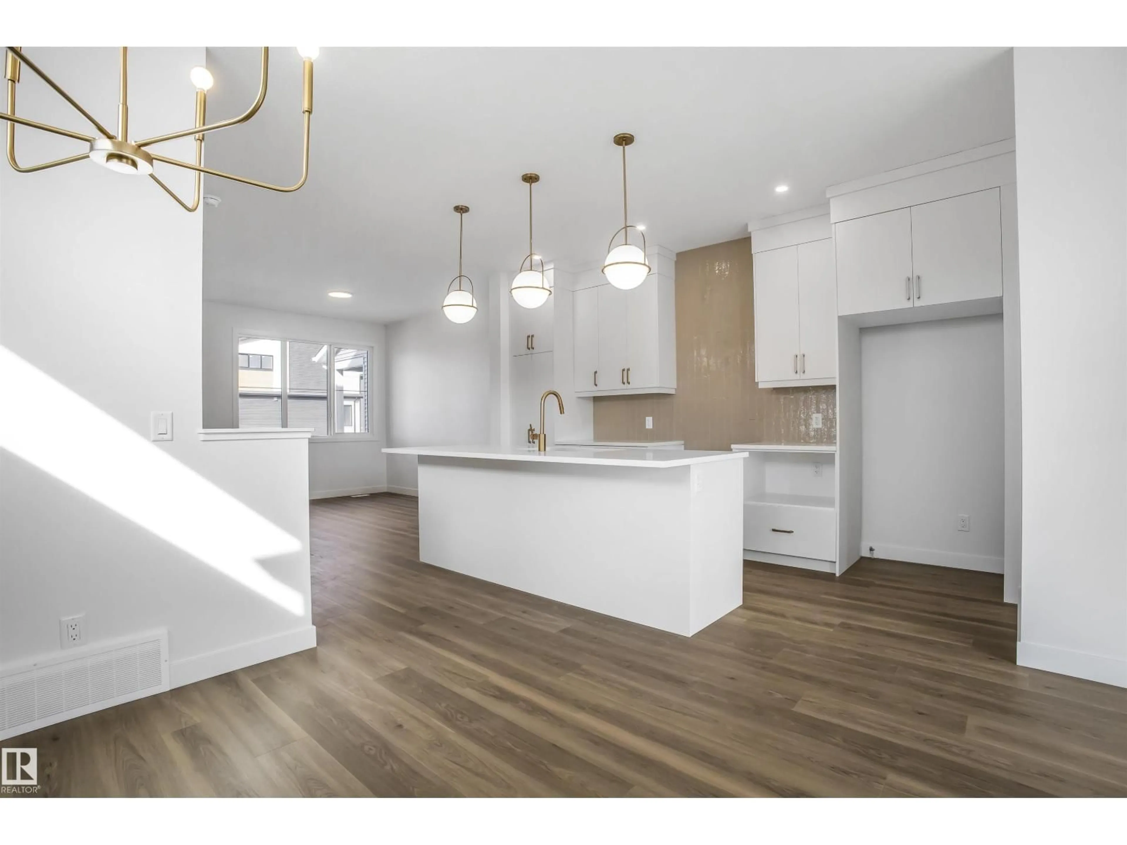 Open concept kitchen, wood/laminate floor for 9125 ELVES LO, Edmonton Alberta T6M3G2