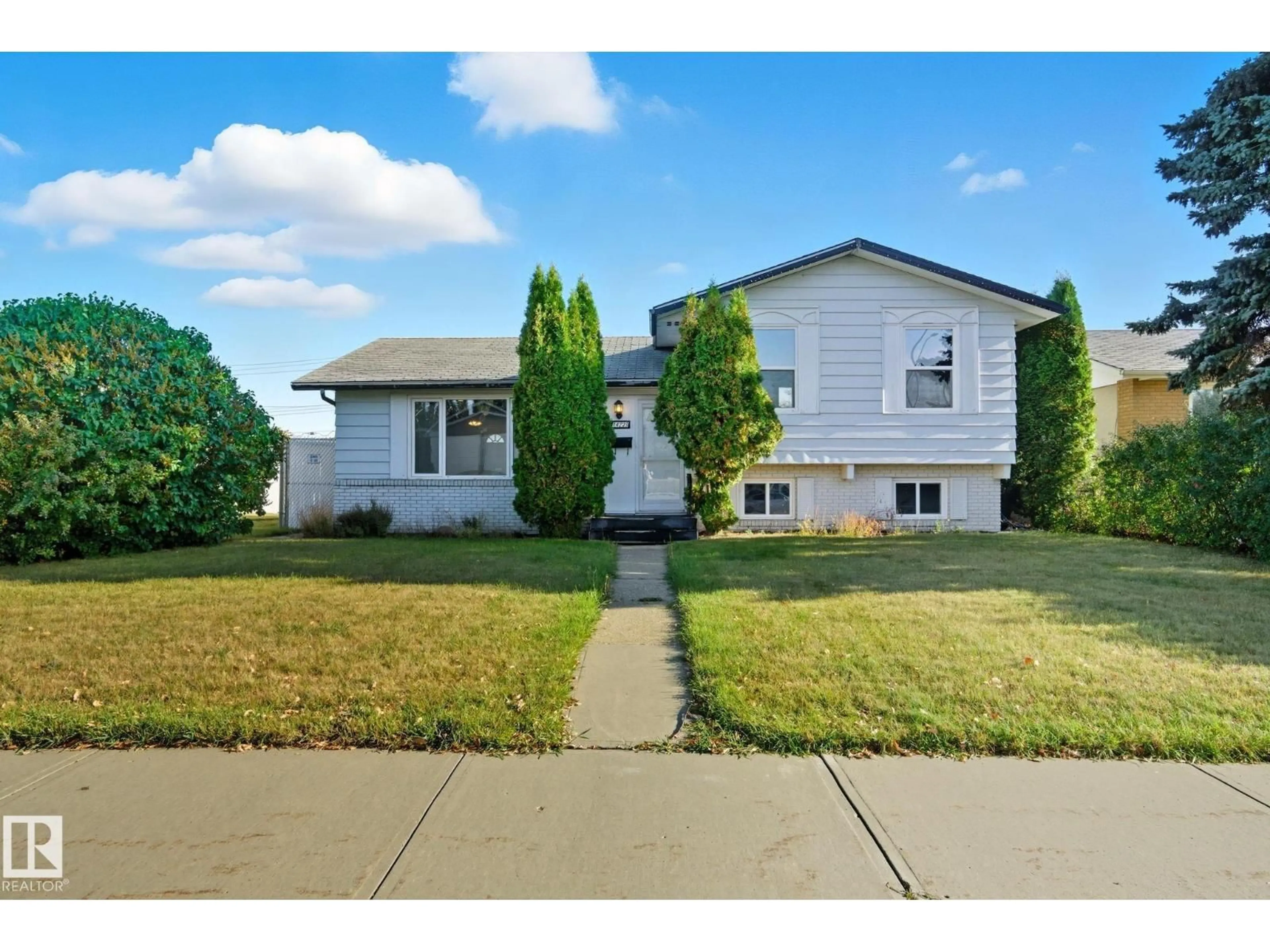 Home with vinyl exterior material, street for 14239 53 ST, Edmonton Alberta T5A1L6