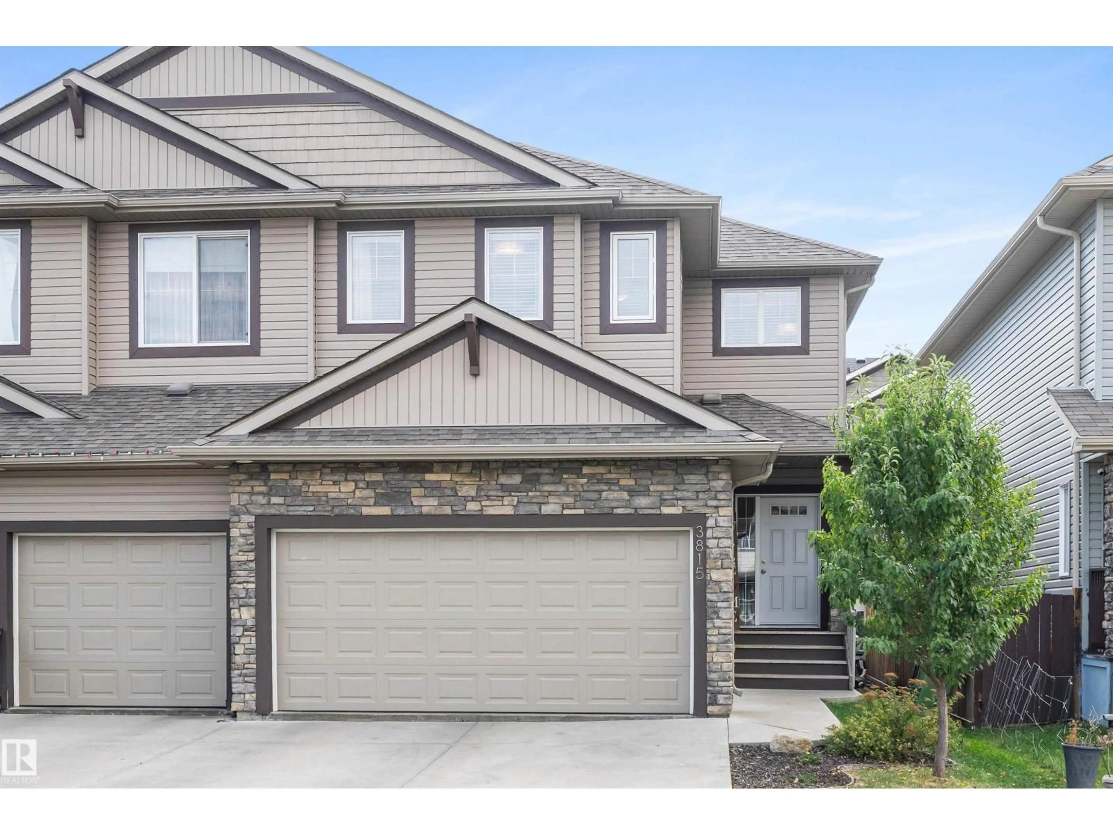 Home with vinyl exterior material, street for 3815 170 AV, Edmonton Alberta T5Y3S2