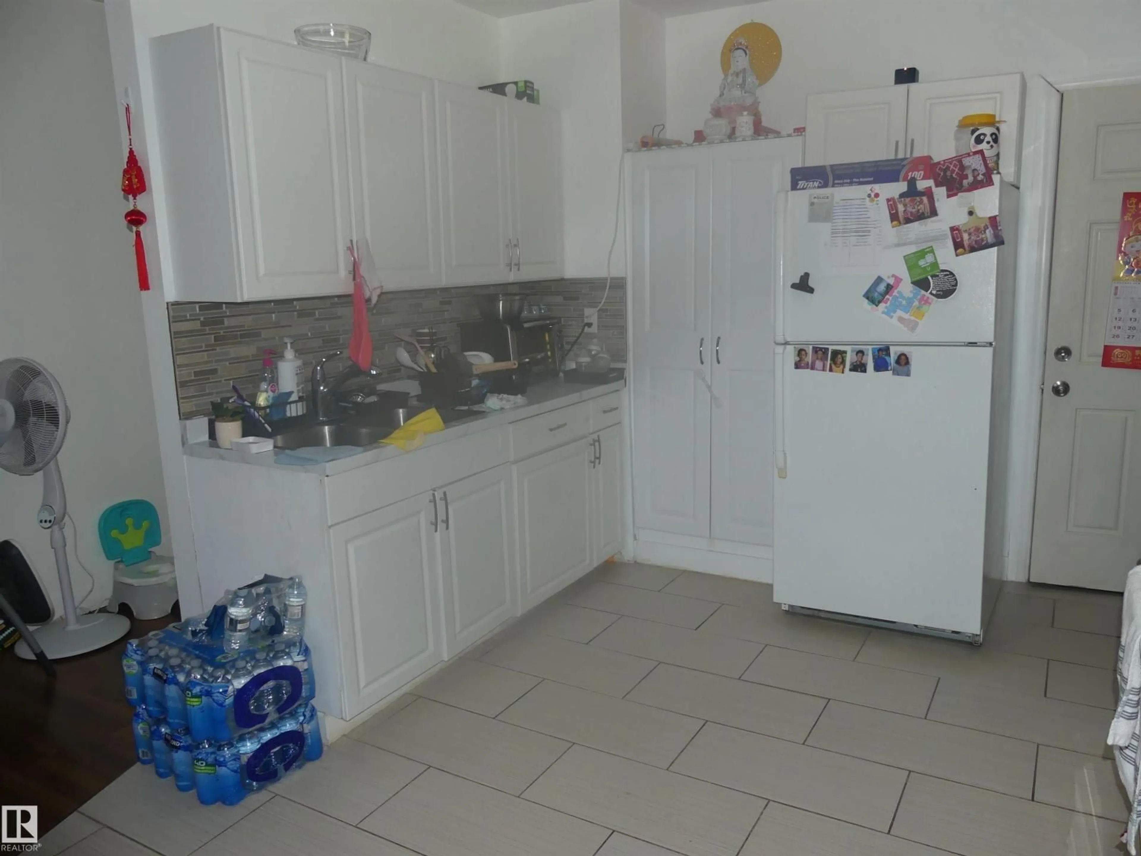 Kitchen with laundary machines, unknown for 10618 96 ST, Edmonton Alberta T5H2J2