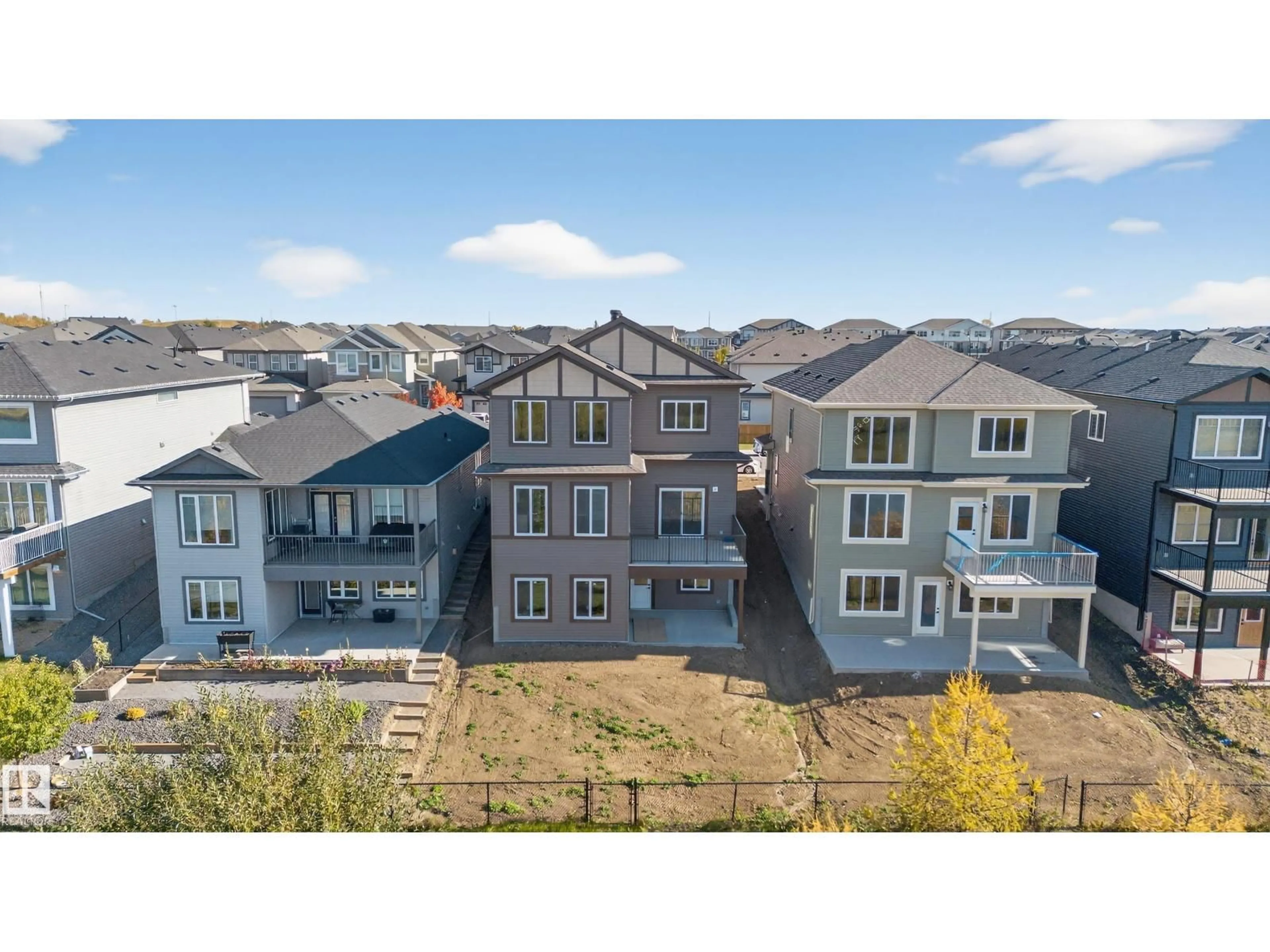 A pic from outside/outdoor area/front of a property/back of a property/a pic from drone, mountain view for 474 ROBERTS CR, Leduc Alberta T9E1N4