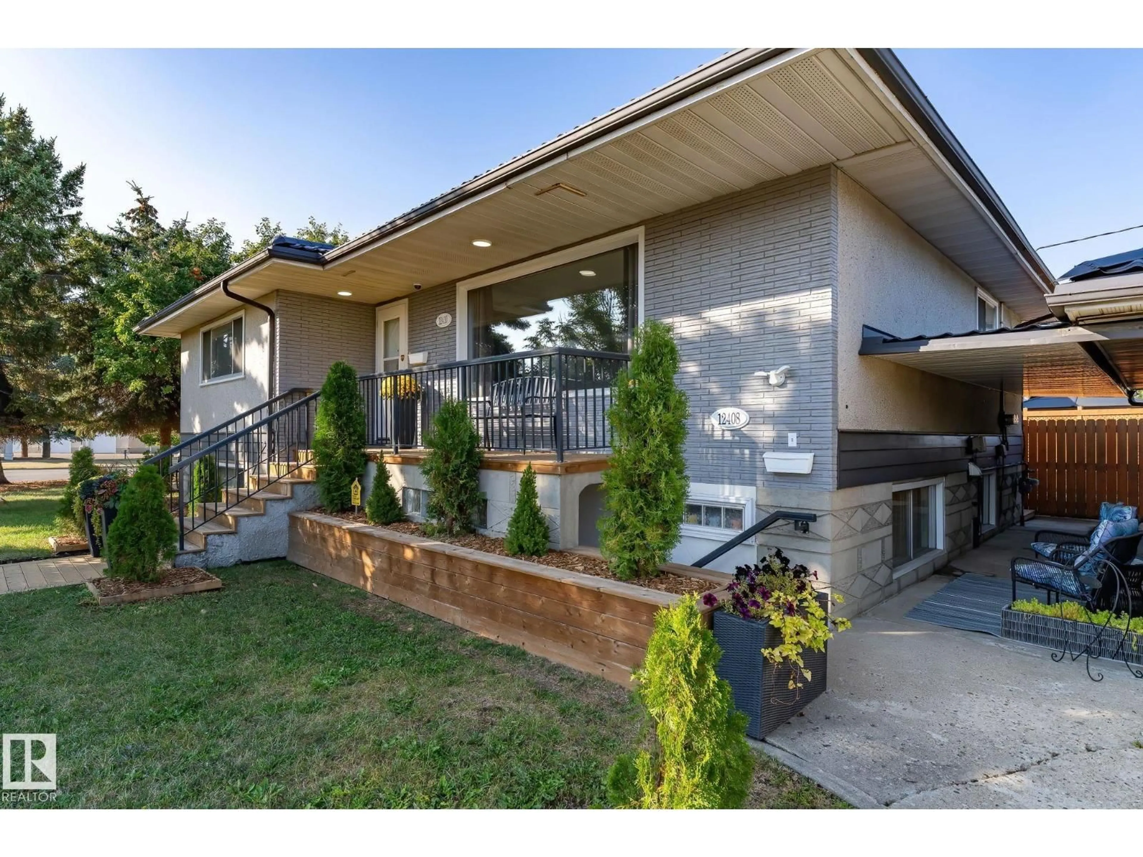 Home with brick exterior material, street for 12410 134 AV, Edmonton Alberta T5J3Y4