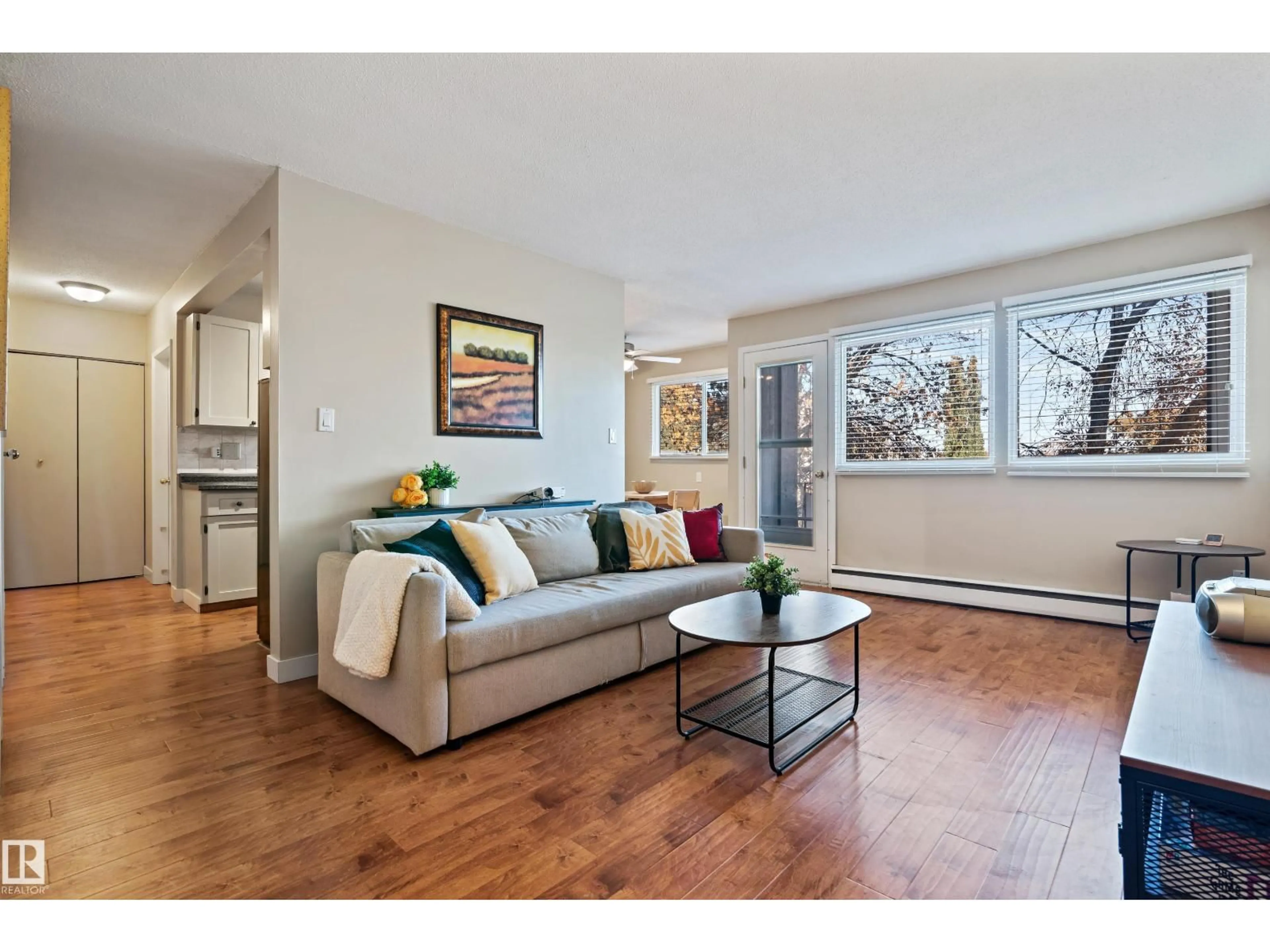 Living room with furniture, wood/laminate floor for #10 - 5635 105 ST, Edmonton Alberta T6H2N2