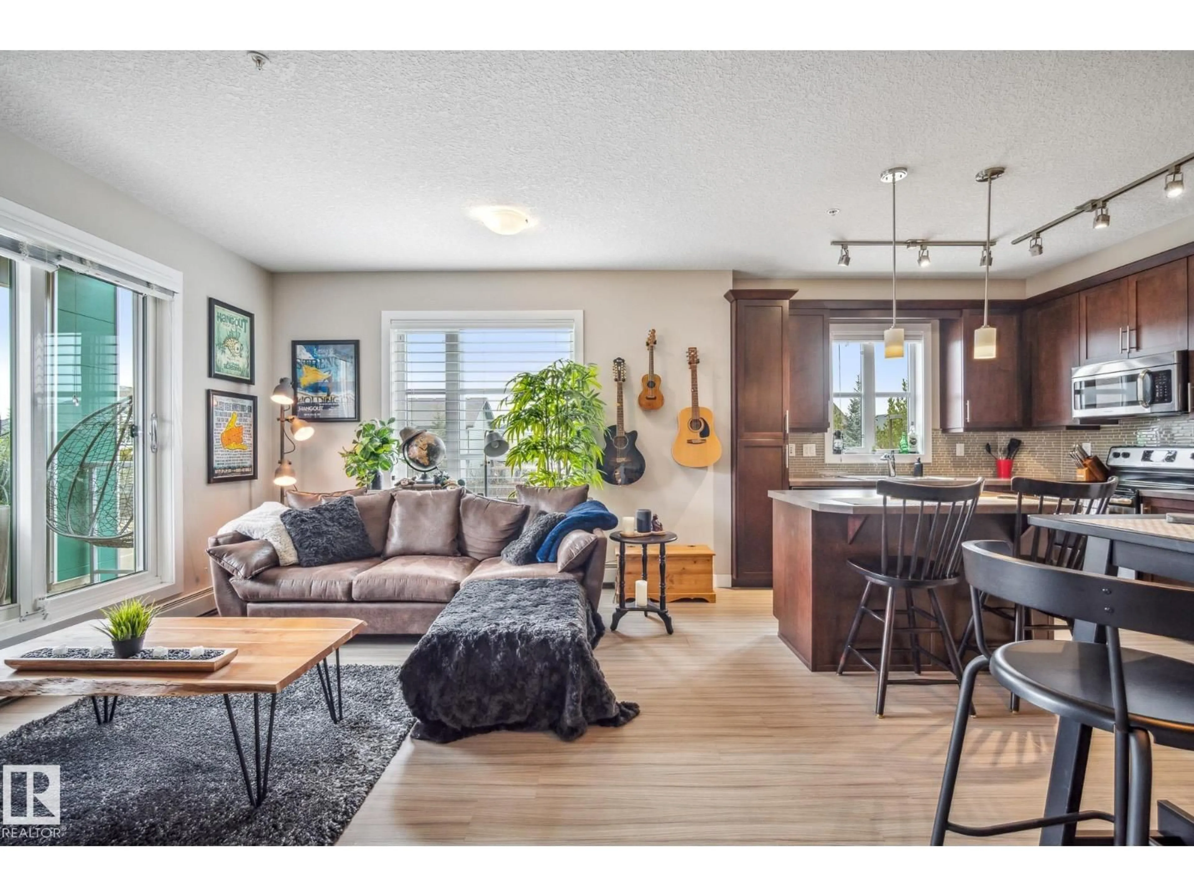 Living room with furniture, wood/laminate floor for 204 - 2588 ANDERSON WY, Edmonton Alberta T6W0R2