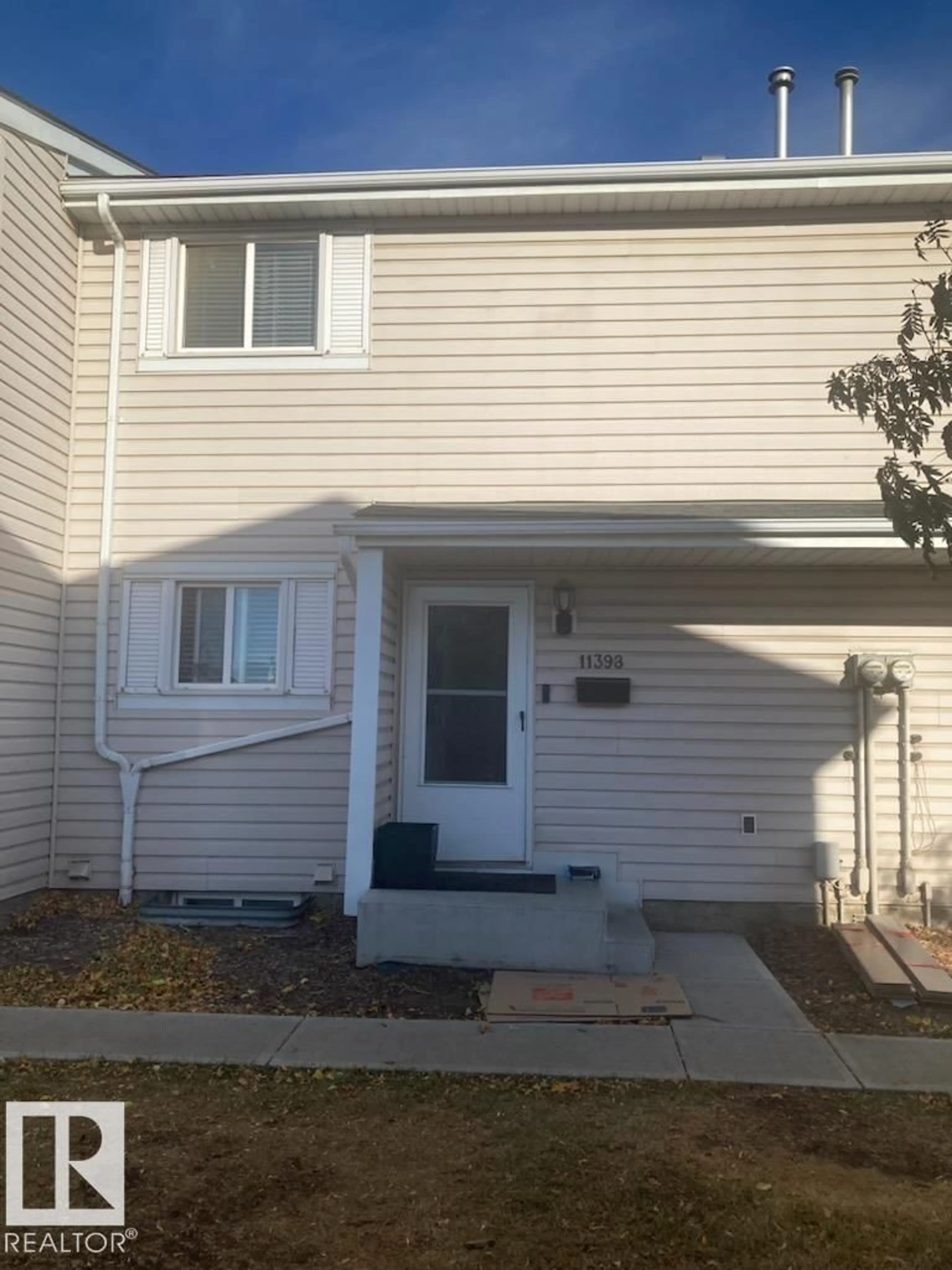 Home with vinyl exterior material, street for NW - 11398 139 AV, Edmonton Alberta T5X3L4