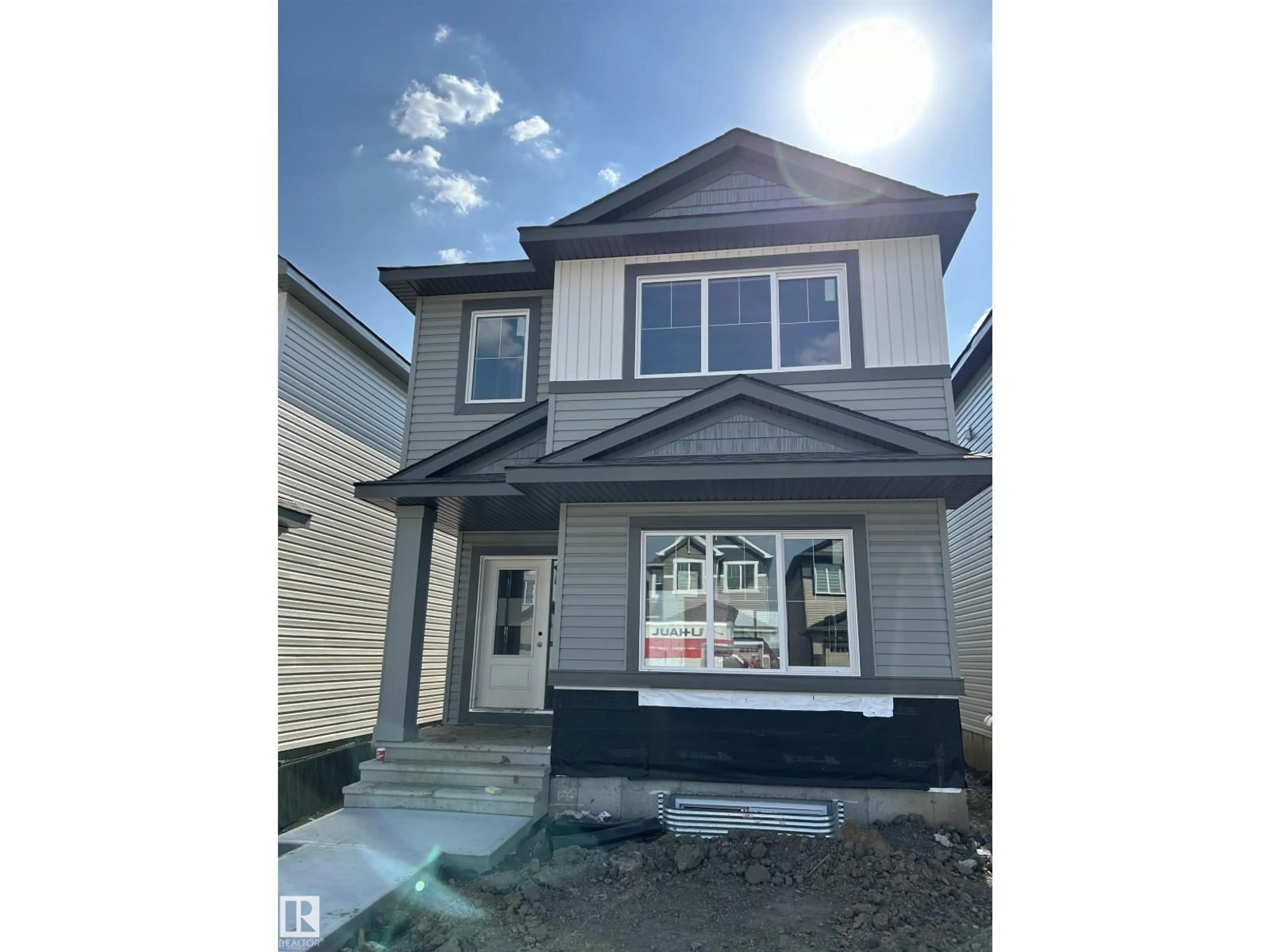 Home with vinyl exterior material, street for NW - 4615 177 AV, Edmonton Alberta T5Y4B7