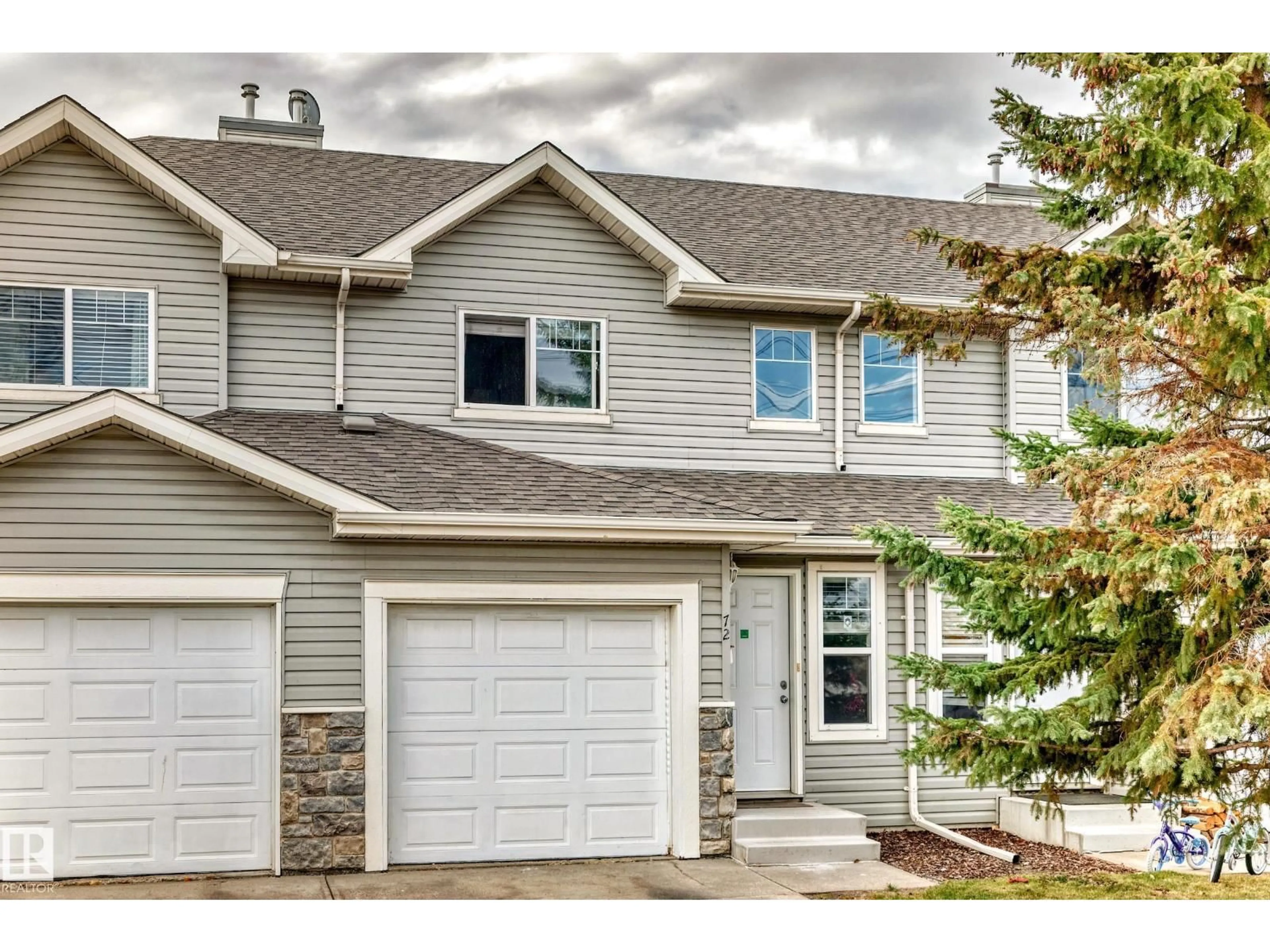 Home with vinyl exterior material, street for 230 - 72 EDWARDS DR, Edmonton Alberta T6X1G7