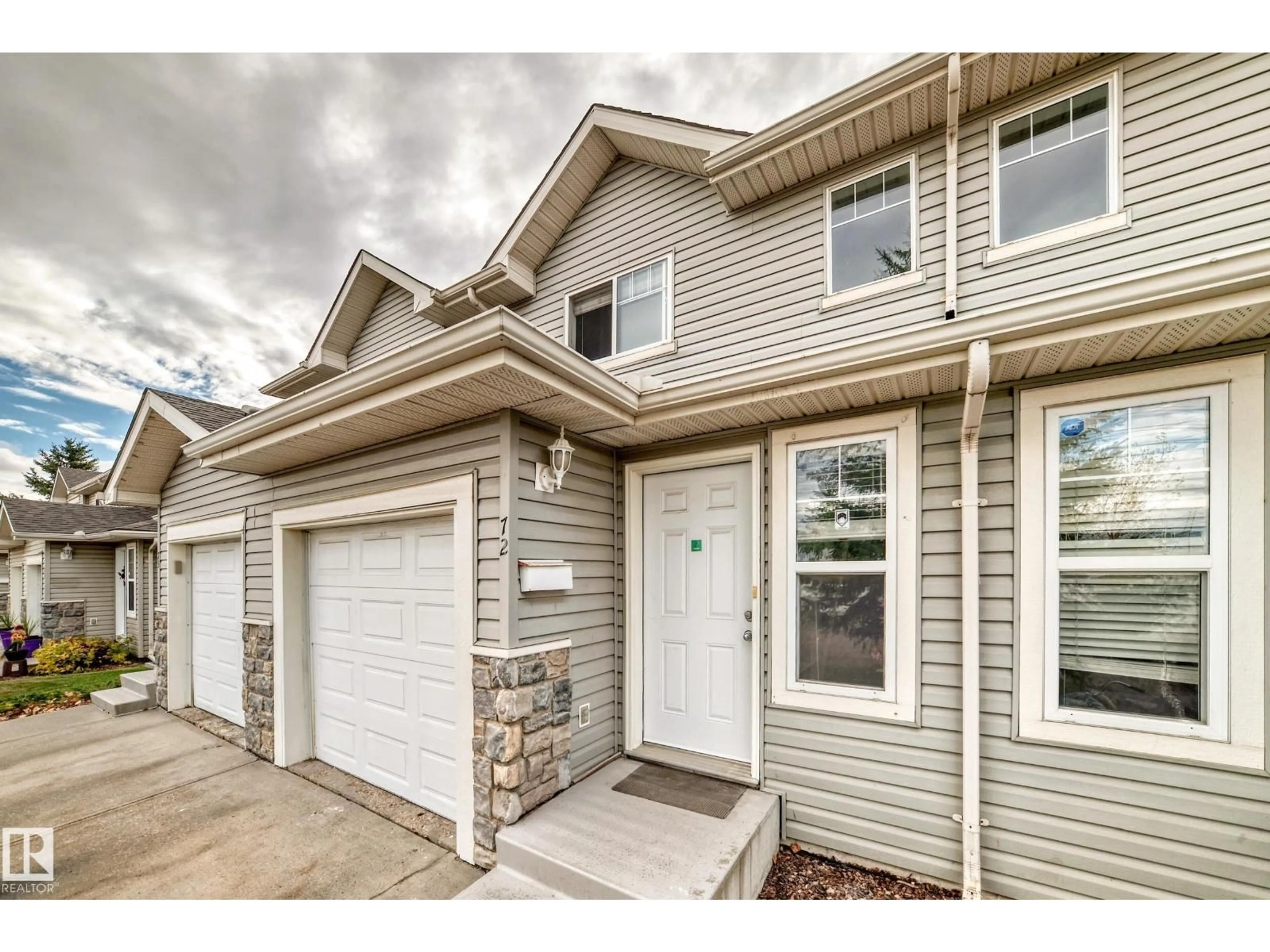 Home with vinyl exterior material, street for 230 - 72 EDWARDS DR, Edmonton Alberta T6X1G7