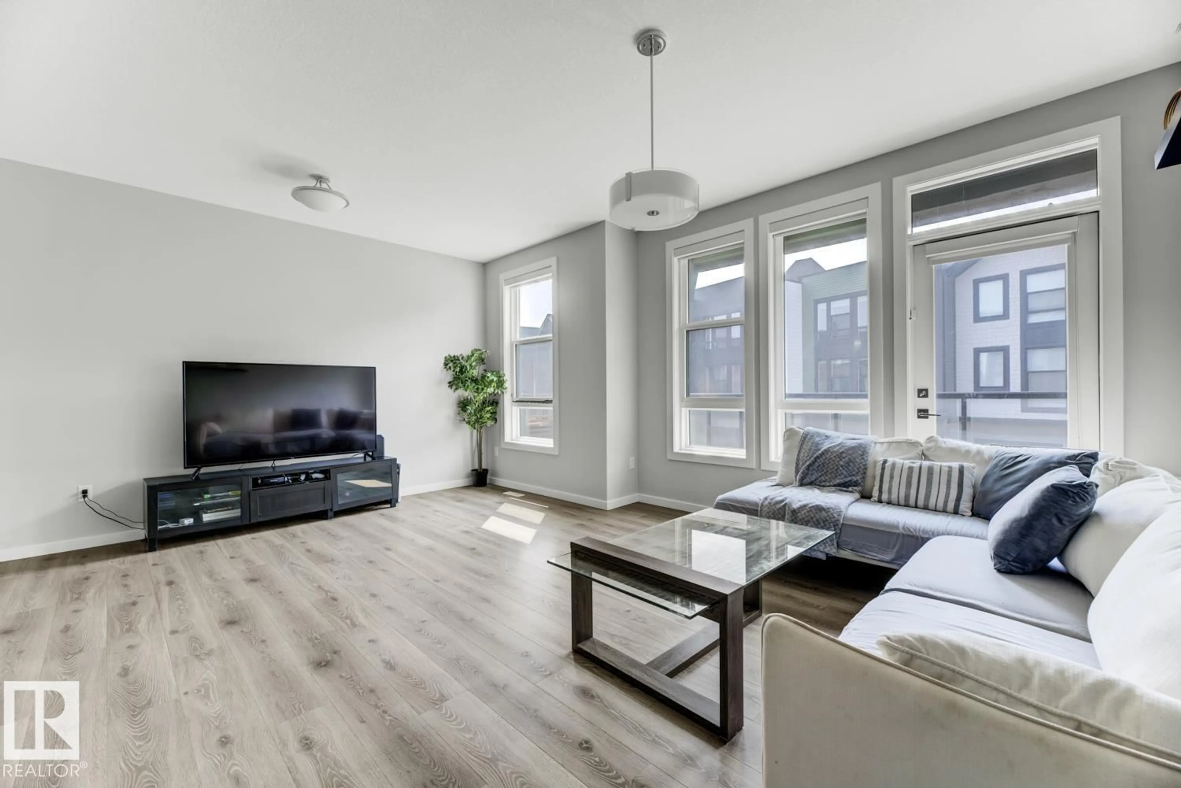 Living room with furniture, wood/laminate floor for #114 - 1304 RUTHERFORD RD, Edmonton Alberta T6W0B4