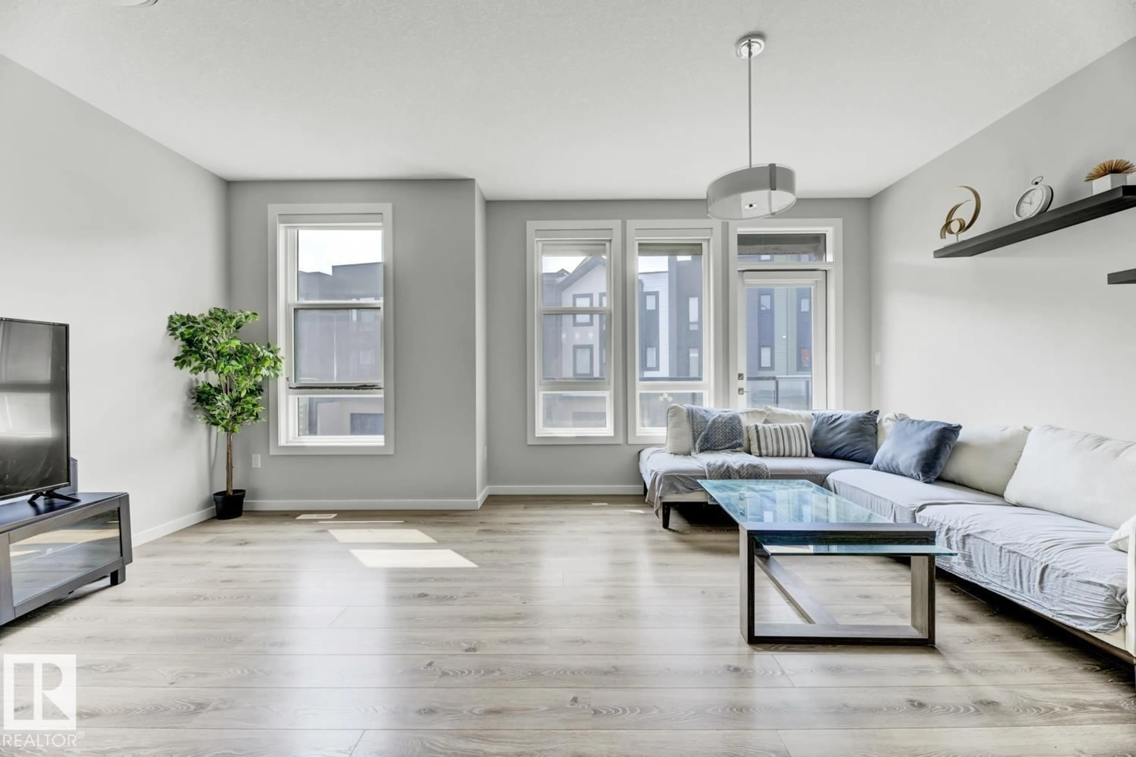 Living room with furniture, wood/laminate floor for #114 - 1304 RUTHERFORD RD, Edmonton Alberta T6W0B4