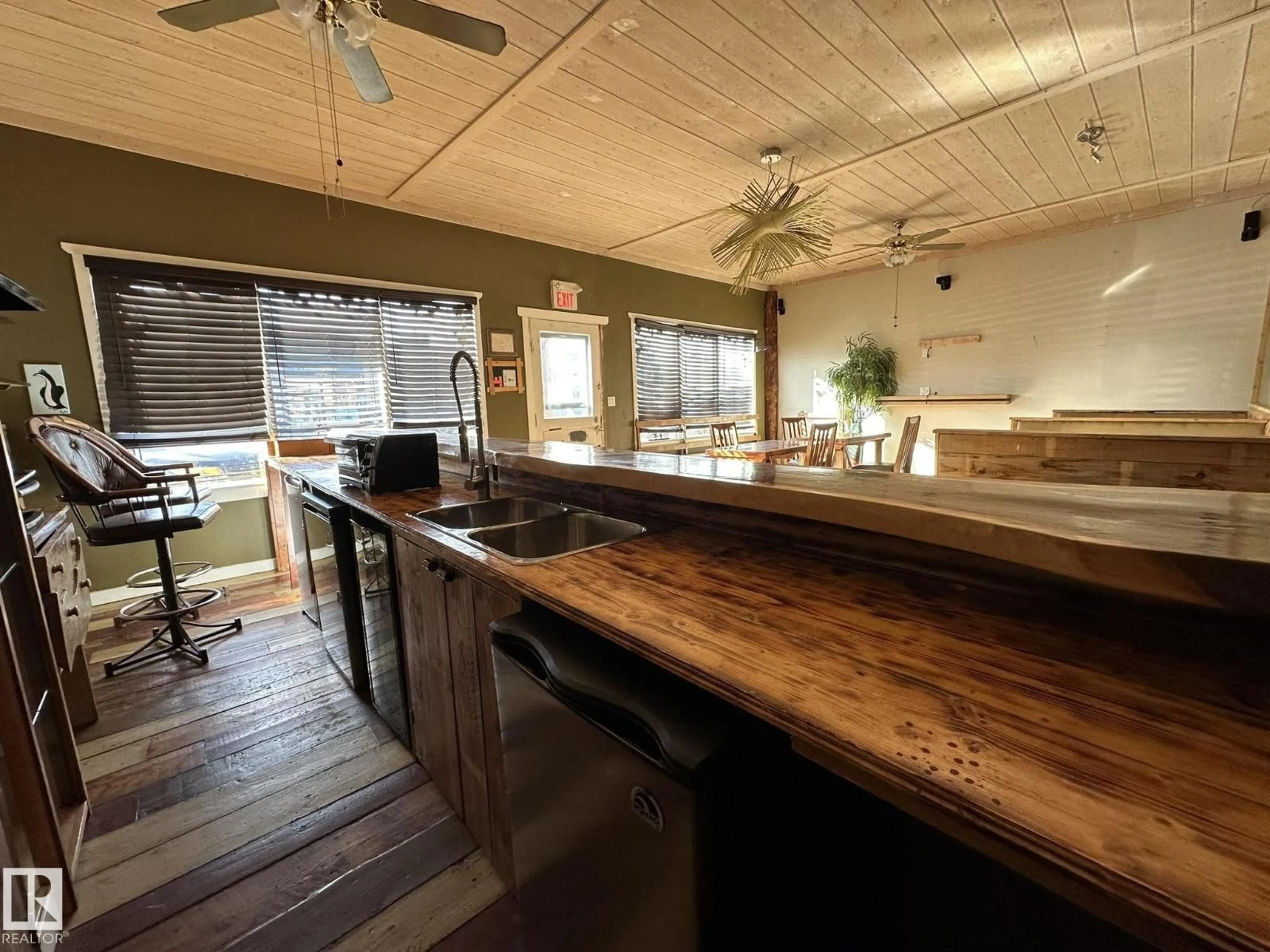 Open concept kitchen, wood/laminate floor for 38 WHEATLAND AV, Smoky Lake Town Alberta T0A3C0