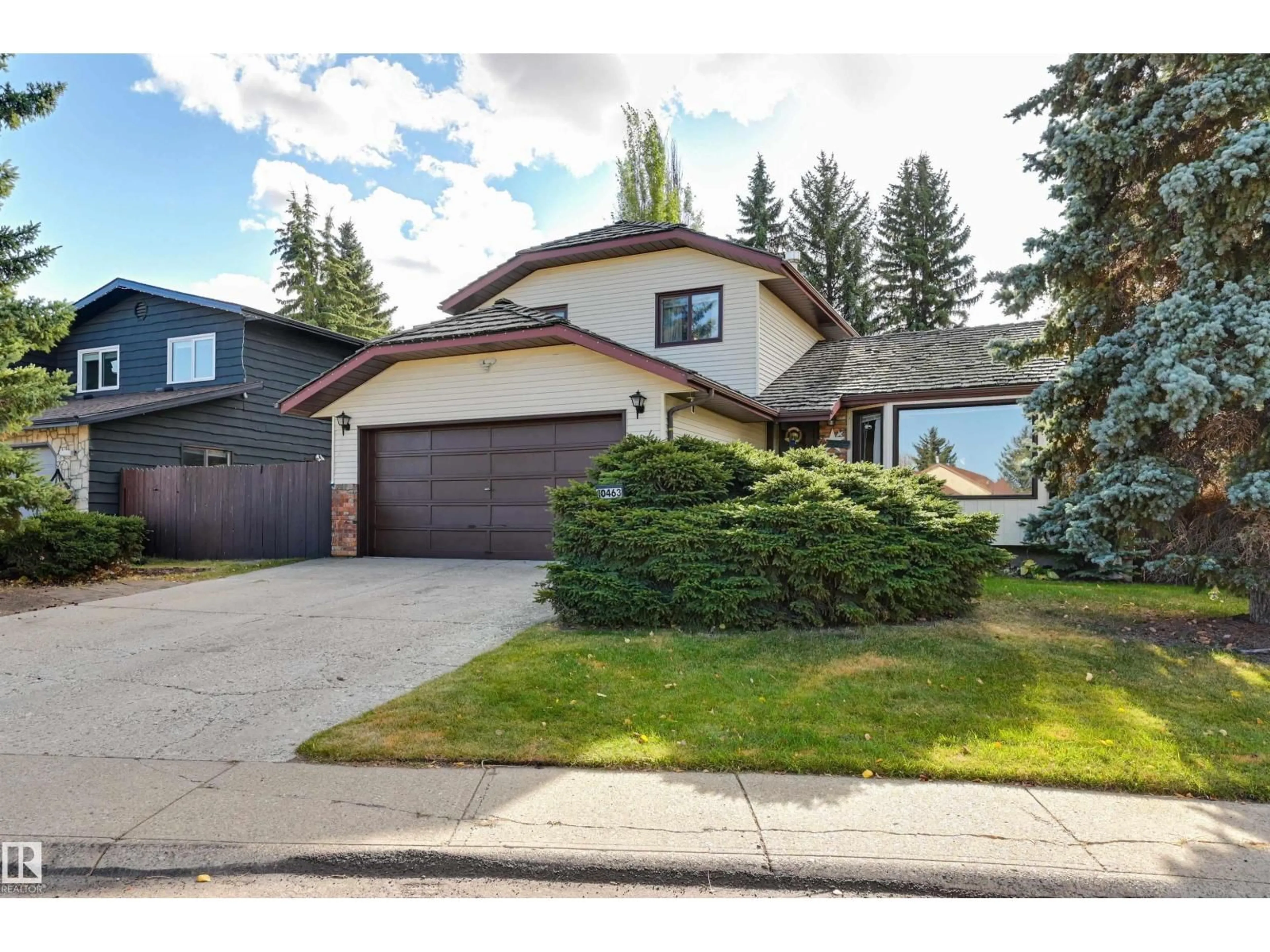 Home with vinyl exterior material, street for NW - 10463 21 AV, Edmonton Alberta T6J5E9