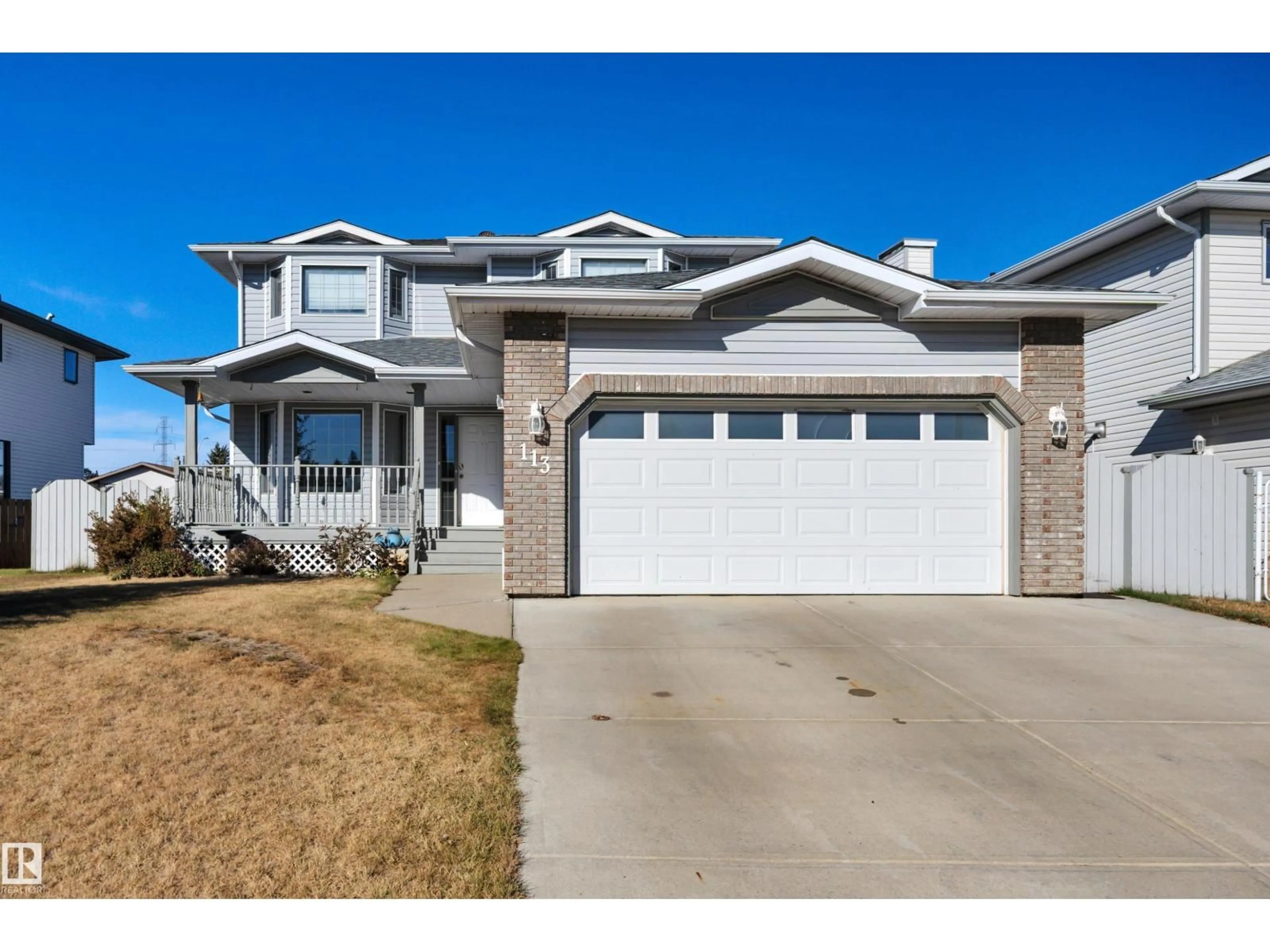 Home with vinyl exterior material, street for 113 PIPESTONE DR, Millet Alberta T0C1Z0