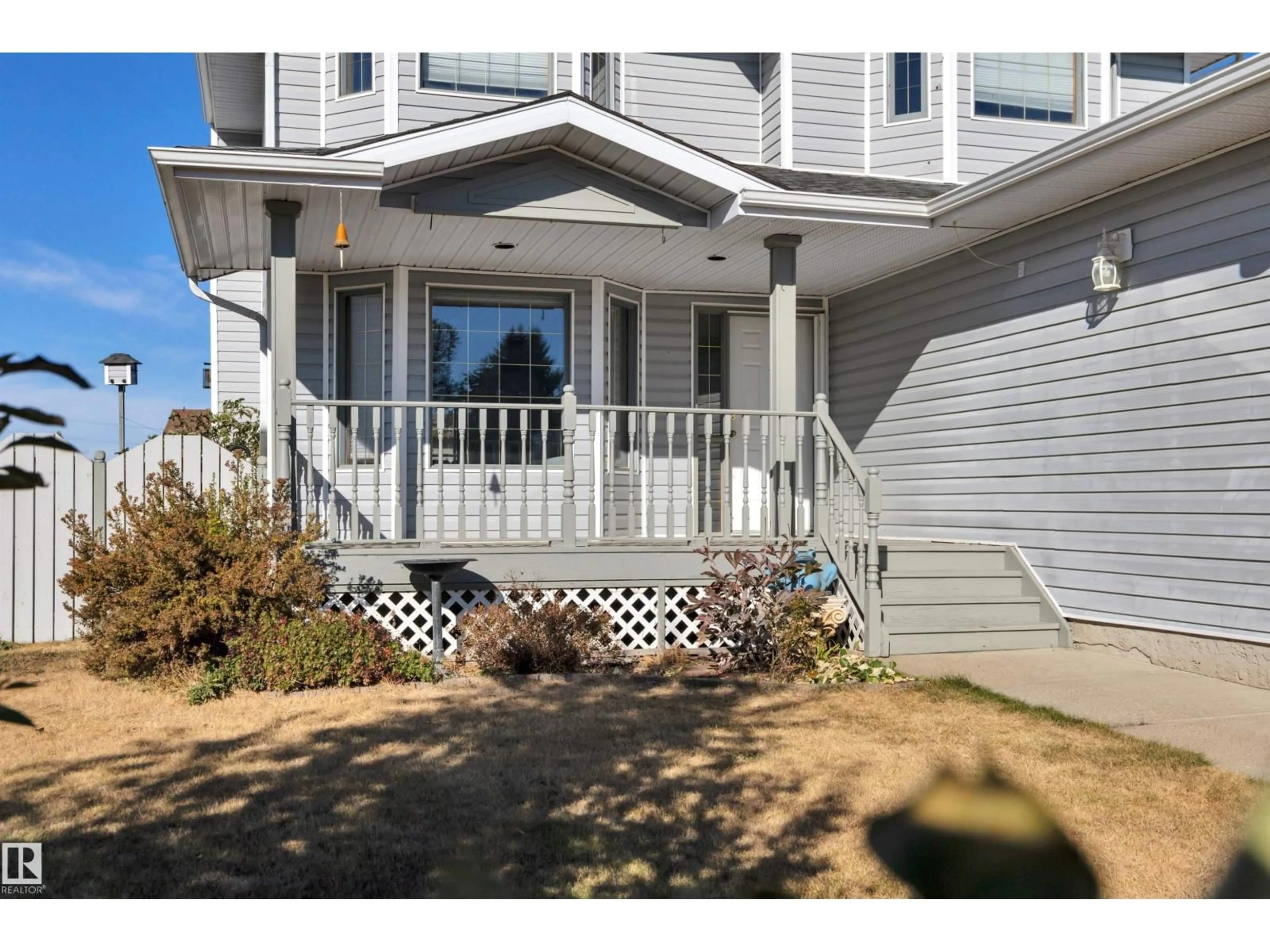 Home with vinyl exterior material, street for 113 PIPESTONE DR, Millet Alberta T0C1Z0