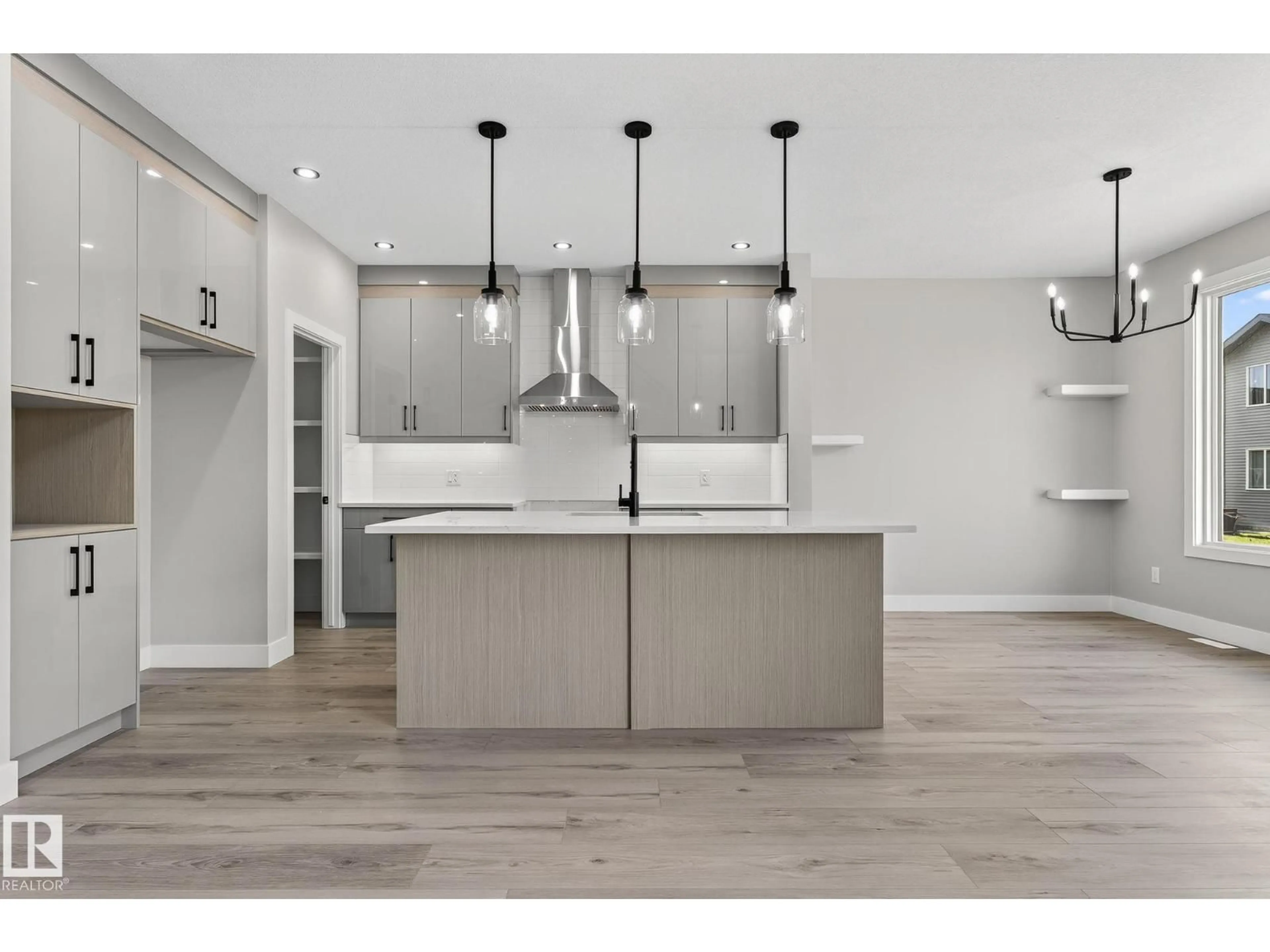 Open concept kitchen, wood/laminate floor for 140 WYATT RG, Fort Saskatchewan Alberta T8L3L7