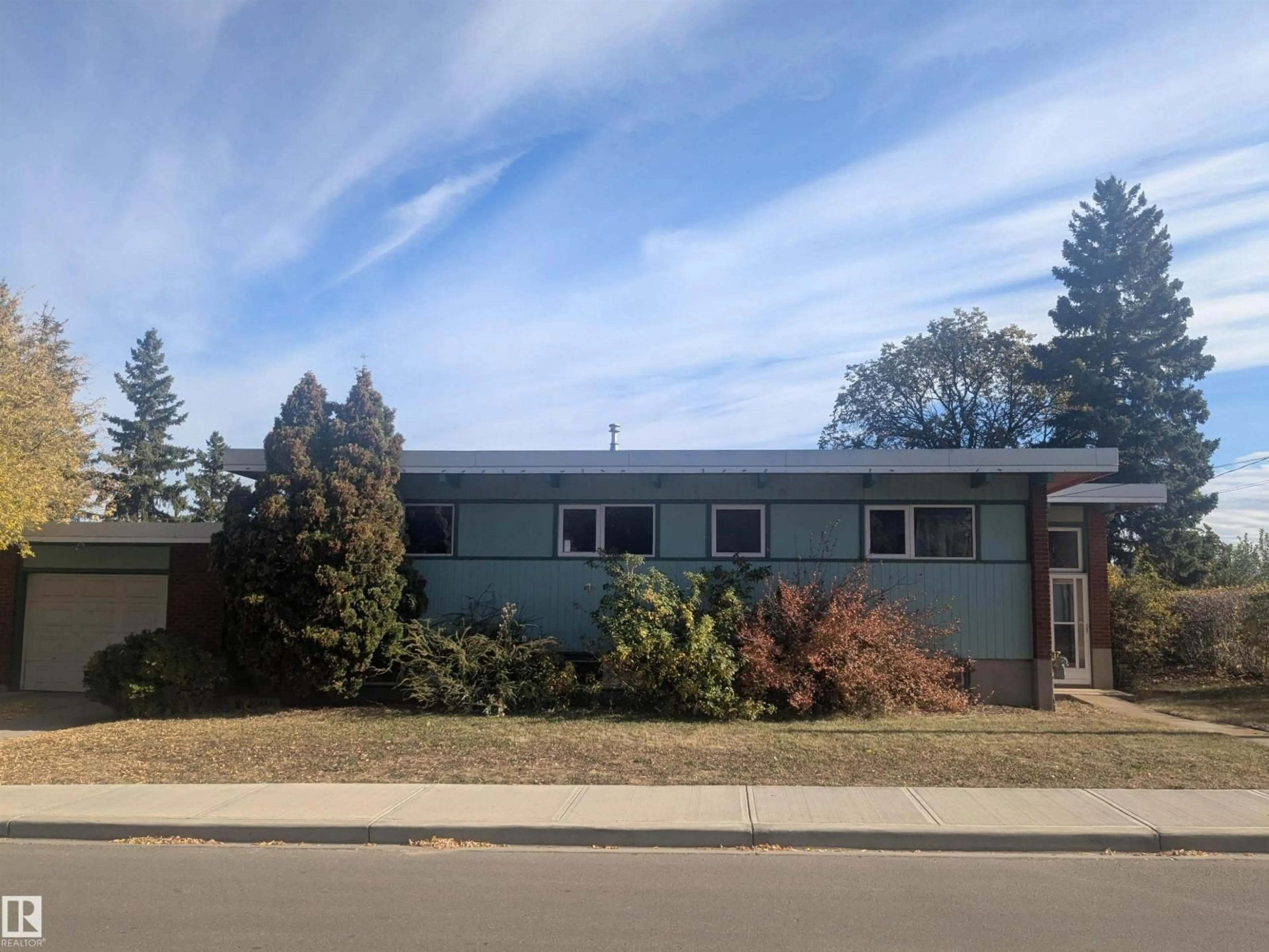 Home with vinyl exterior material, street for NW - 8311 96 ST, Edmonton Alberta T6C3Y4