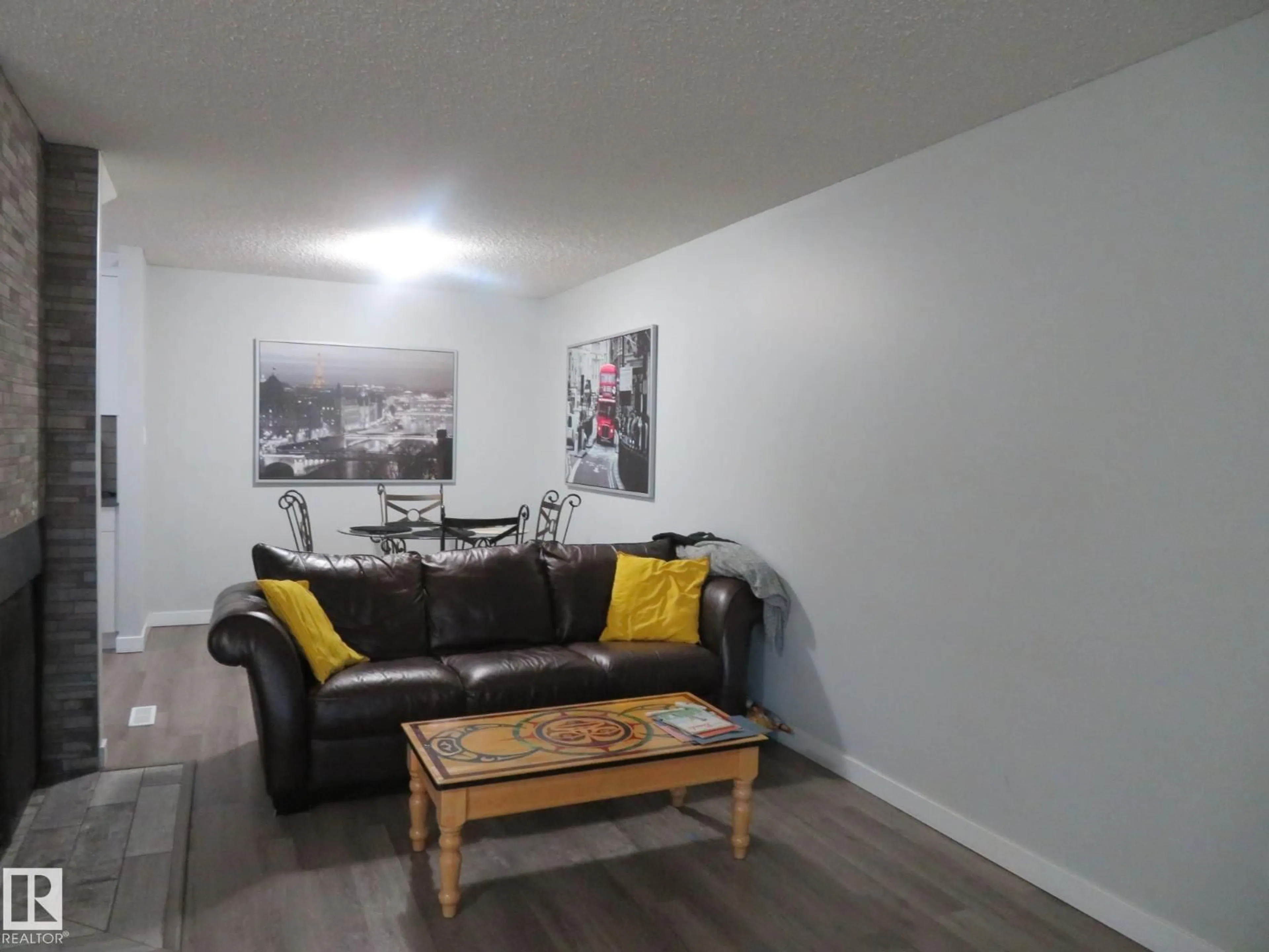 Living room with furniture, wood/laminate floor for NW - 1894 111A ST, Edmonton Alberta T6J4T7