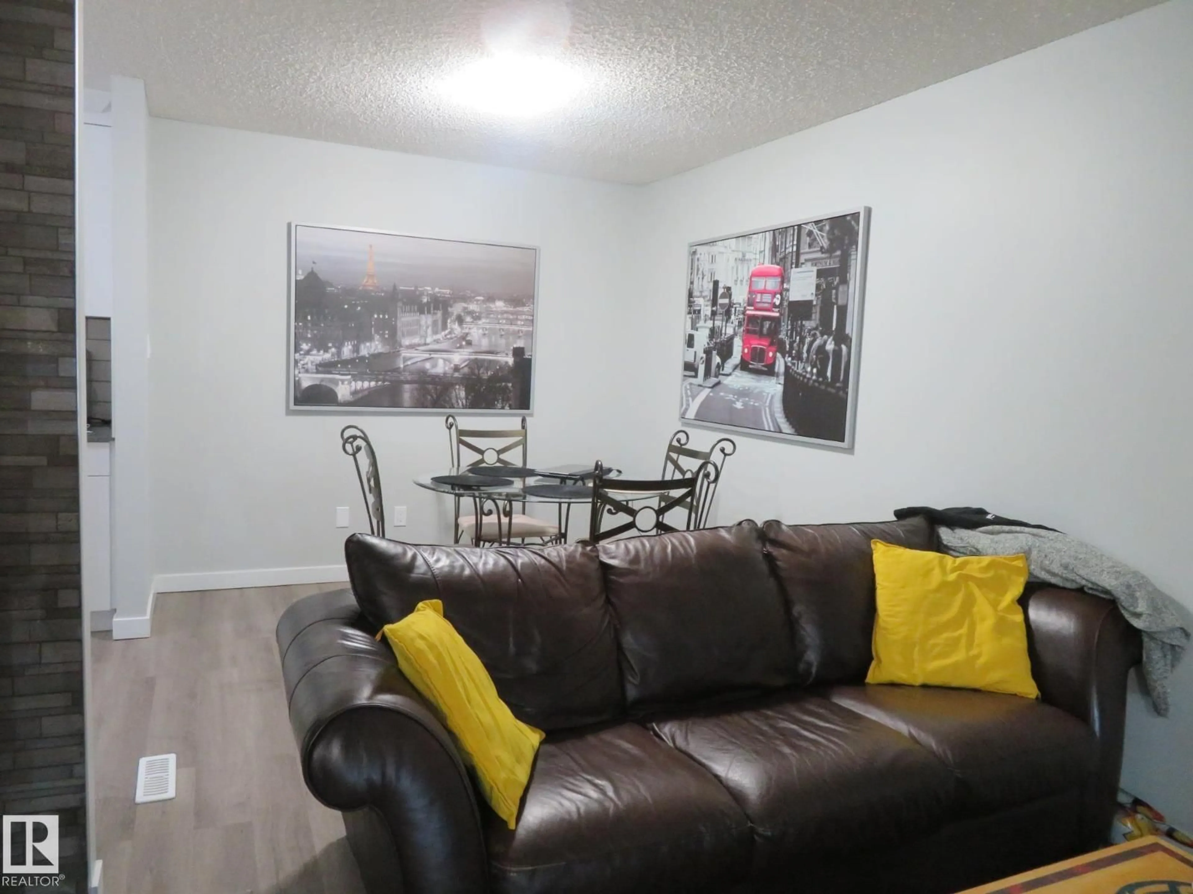 Living room with furniture, wood/laminate floor for NW - 1894 111A ST, Edmonton Alberta T6J4T7