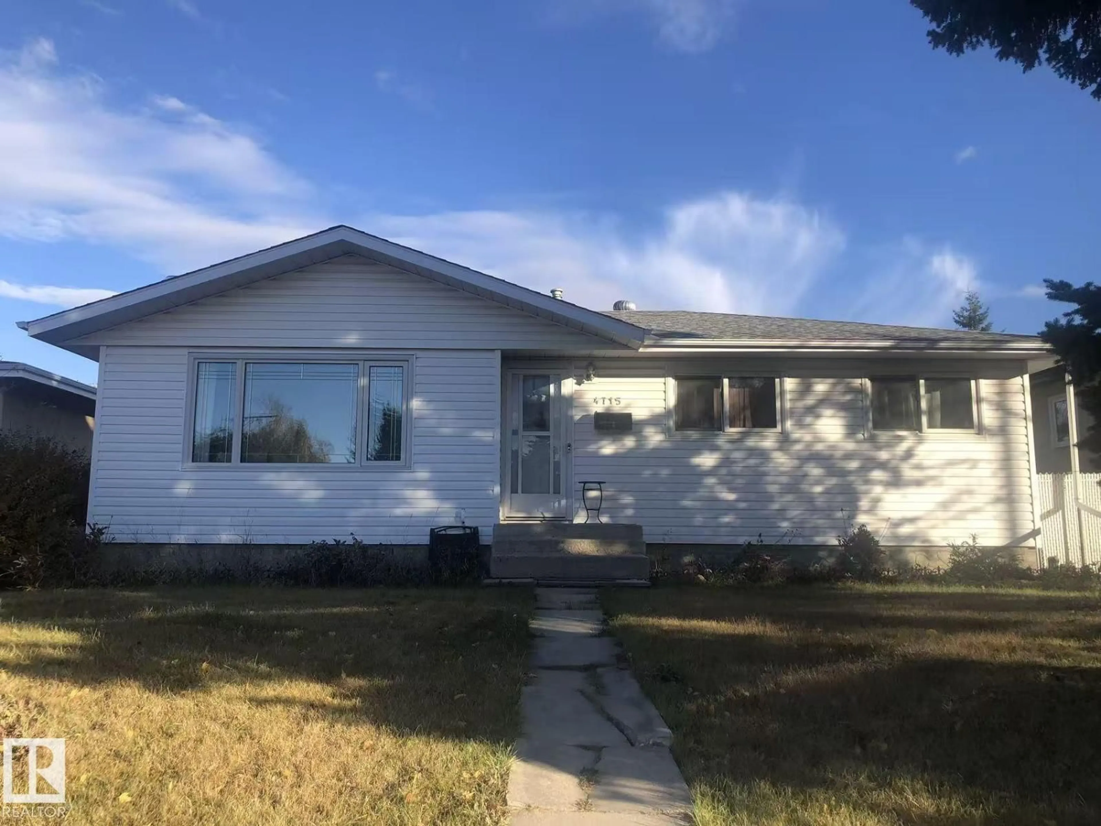 Home with vinyl exterior material, street for 4715 111A NW, Edmonton Alberta T6H3G4