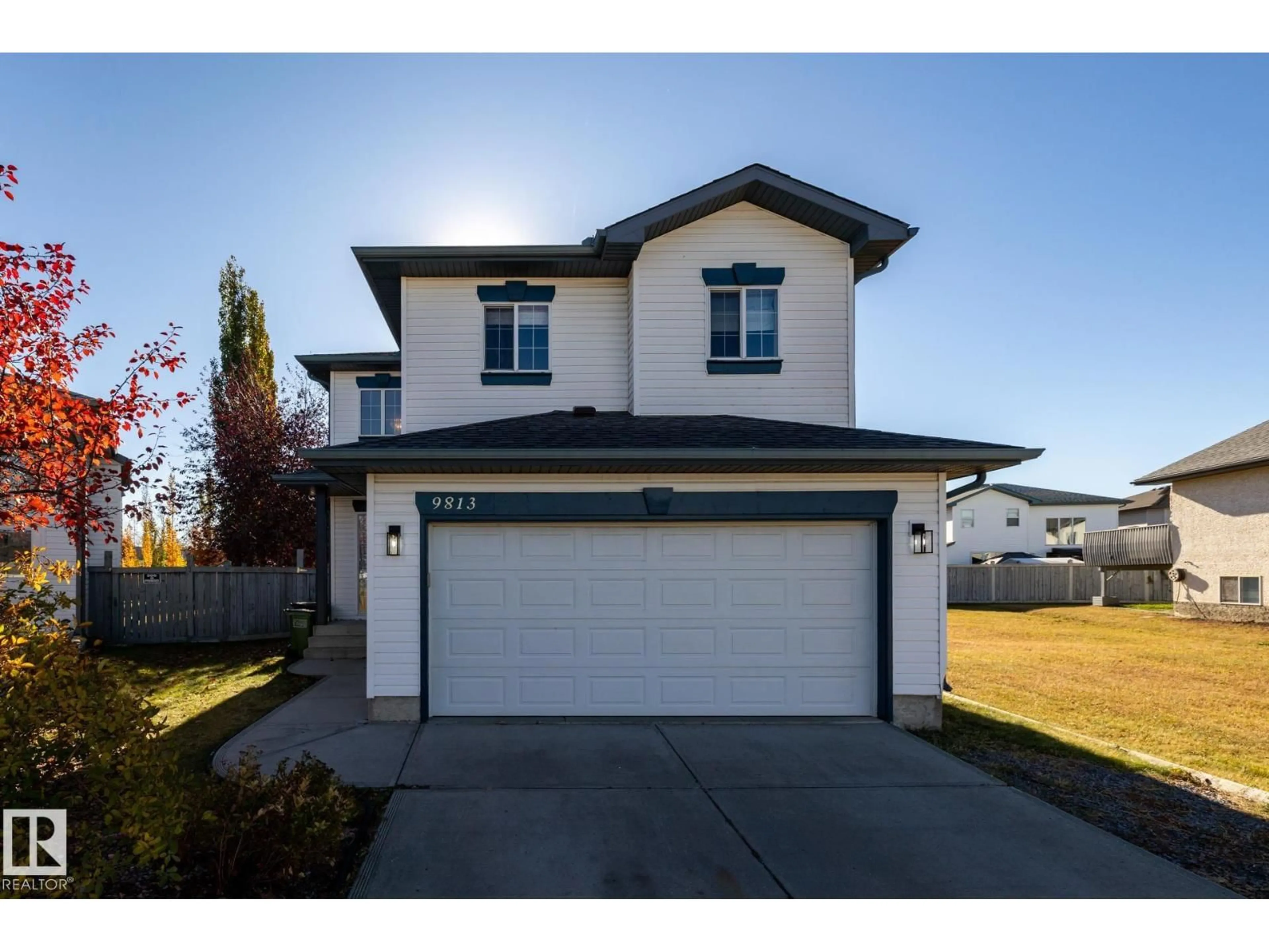 Home with vinyl exterior material, street for NW - 9813 180 AV, Edmonton Alberta T5X6A1