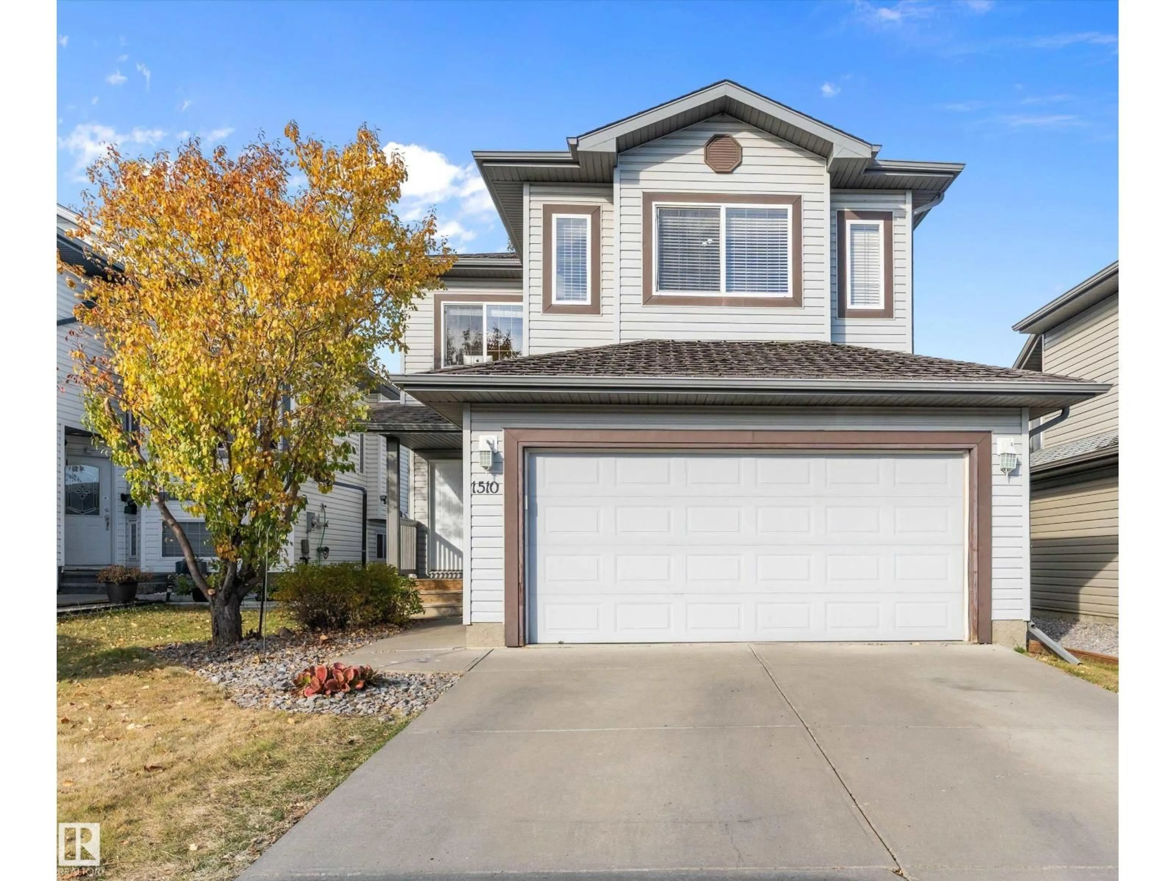 Home with vinyl exterior material, street for 1510 37A AV, Edmonton Alberta T6T0E3