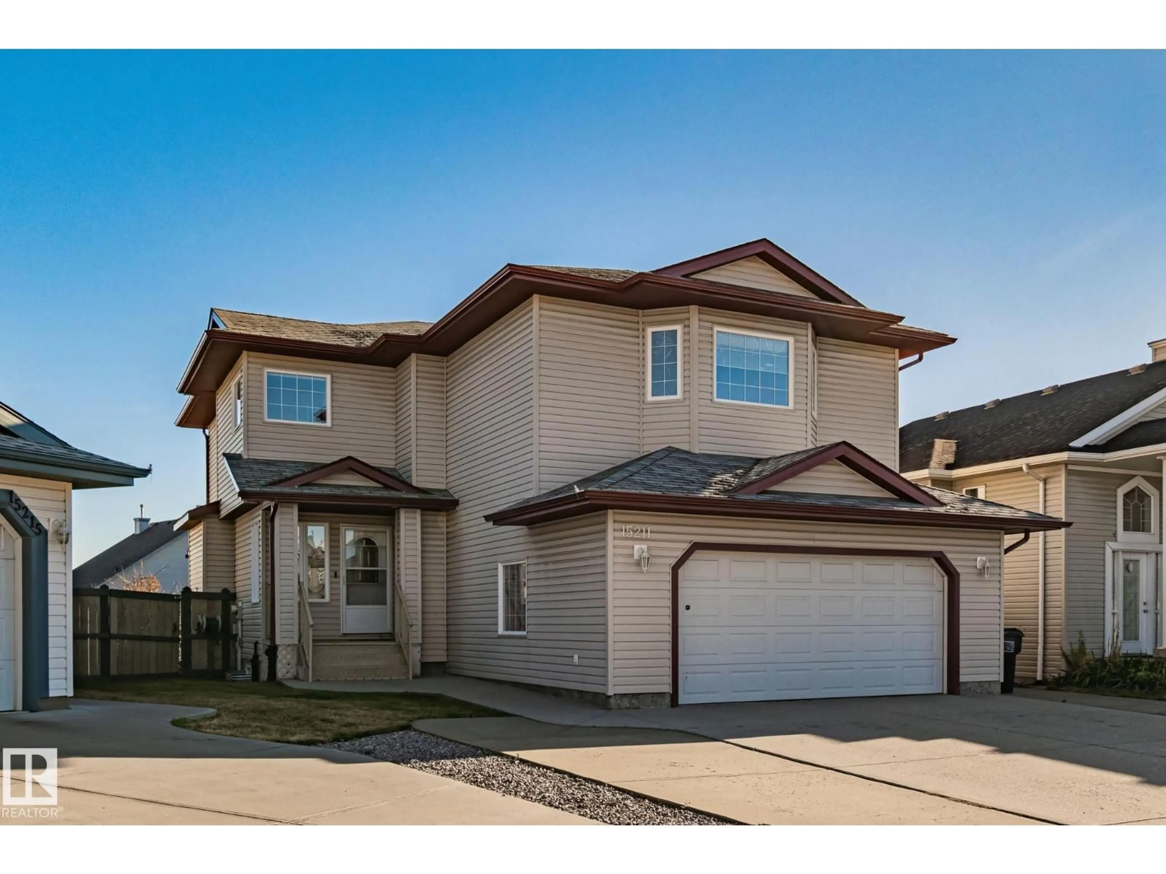 Home with vinyl exterior material, street for NW - 15211 44 ST, Edmonton Alberta T5Y3C4