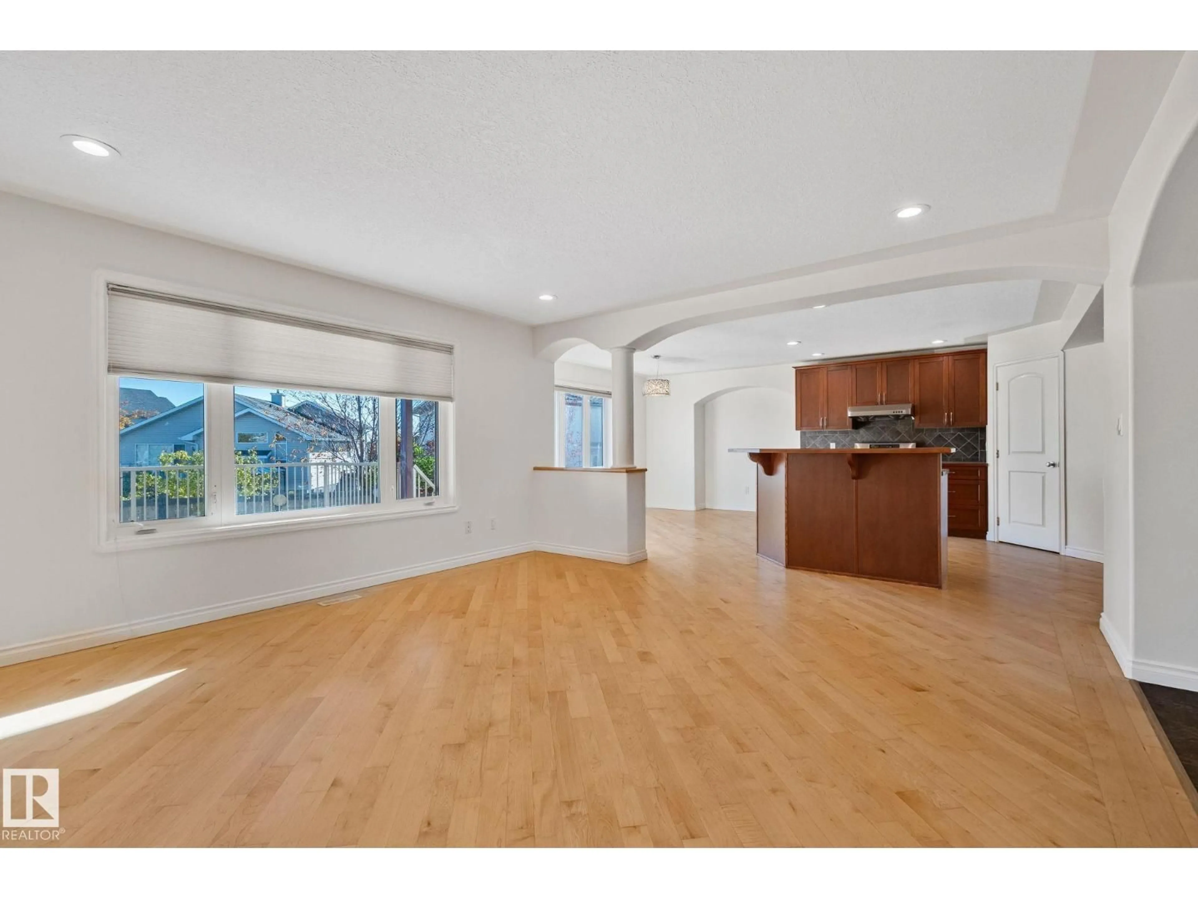 Open concept kitchen, wood/laminate floor for NW - 15211 44 ST, Edmonton Alberta T5Y3C4