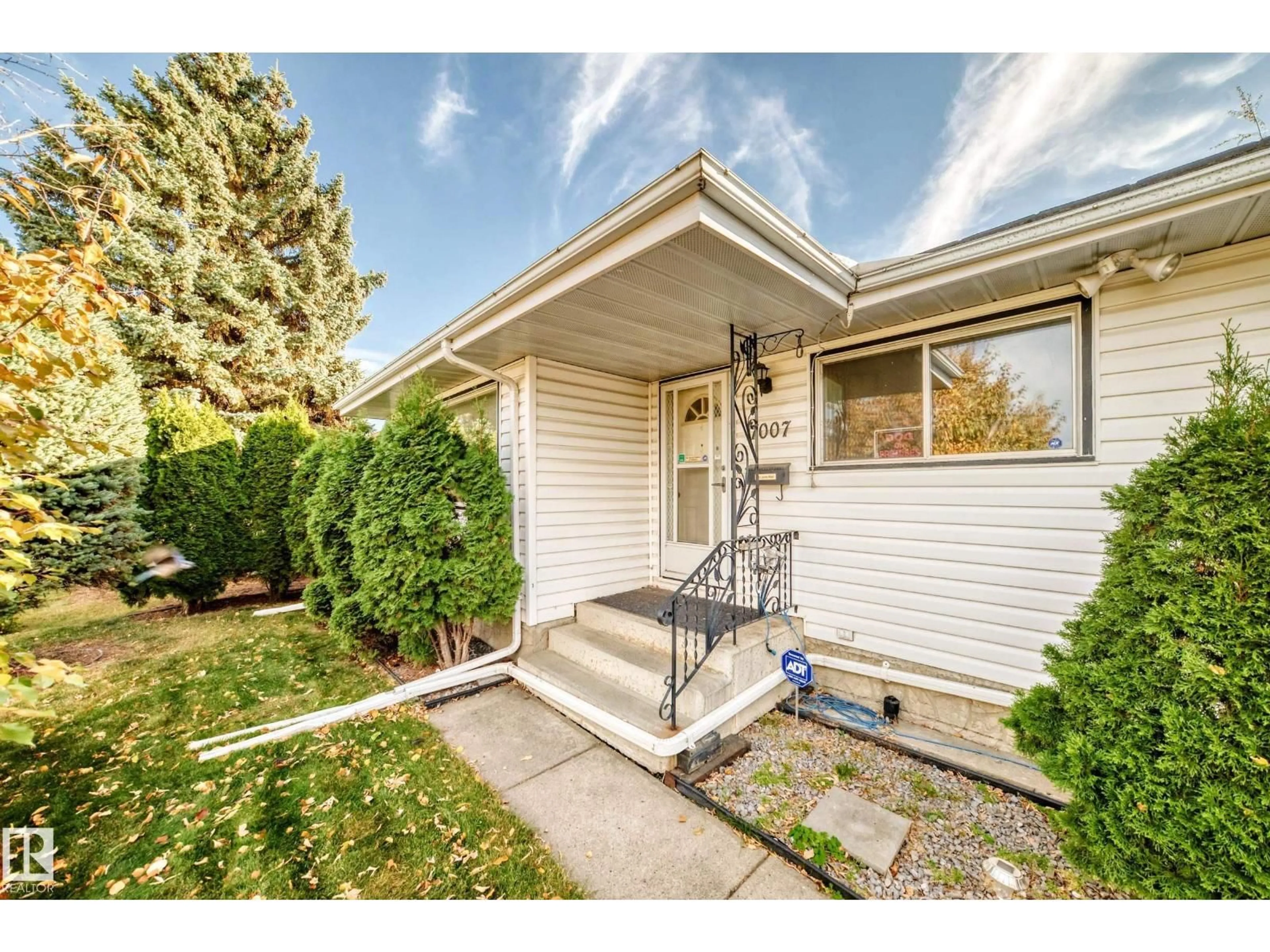 Home with vinyl exterior material, street for 7007 140 AV, Edmonton Alberta T5G2M6